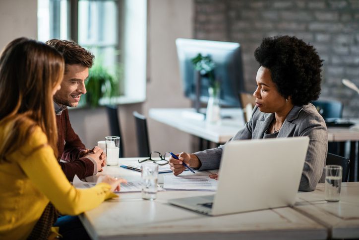 Couple reviewing repayment plan with financial planner