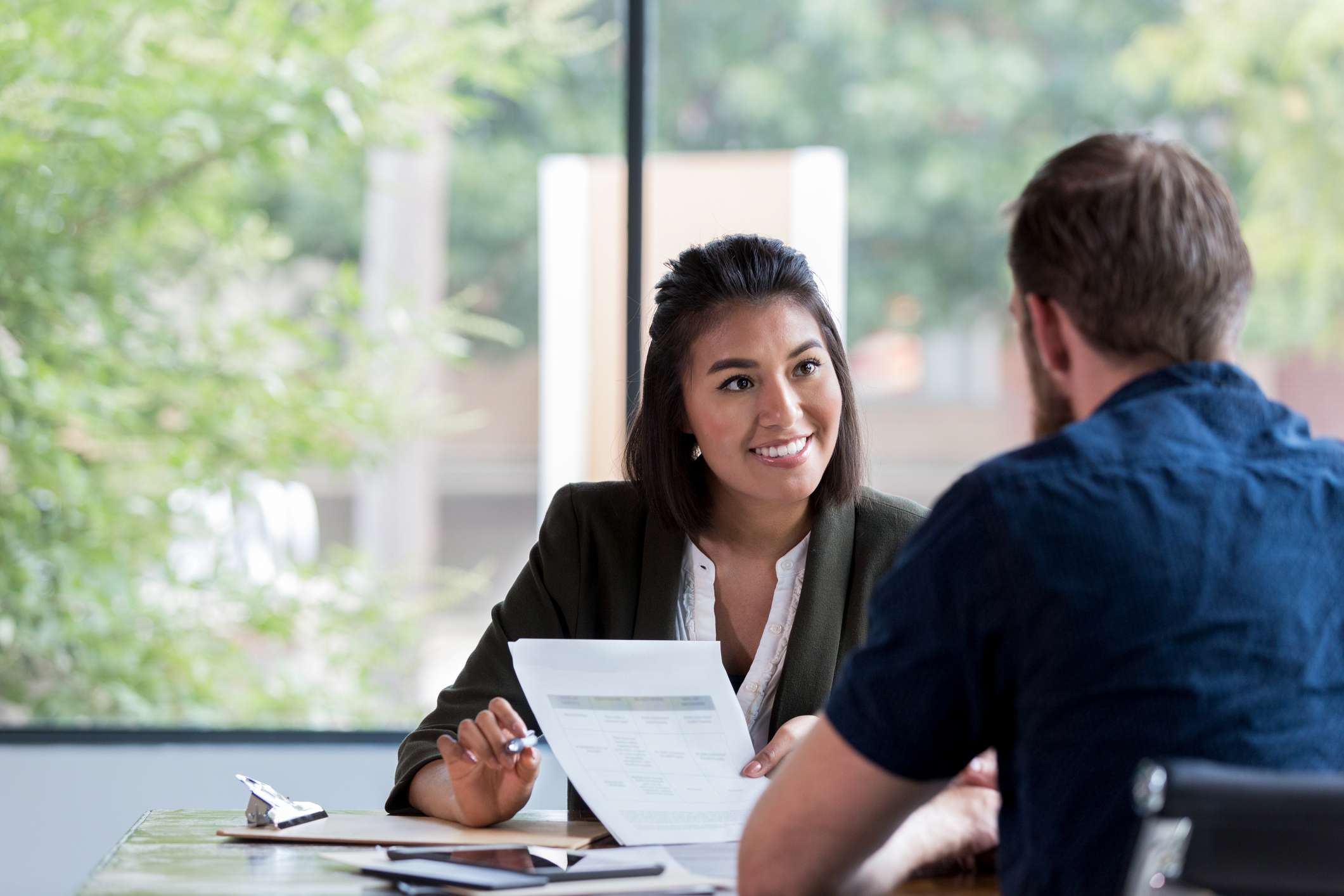 A businesswoman meets with client.