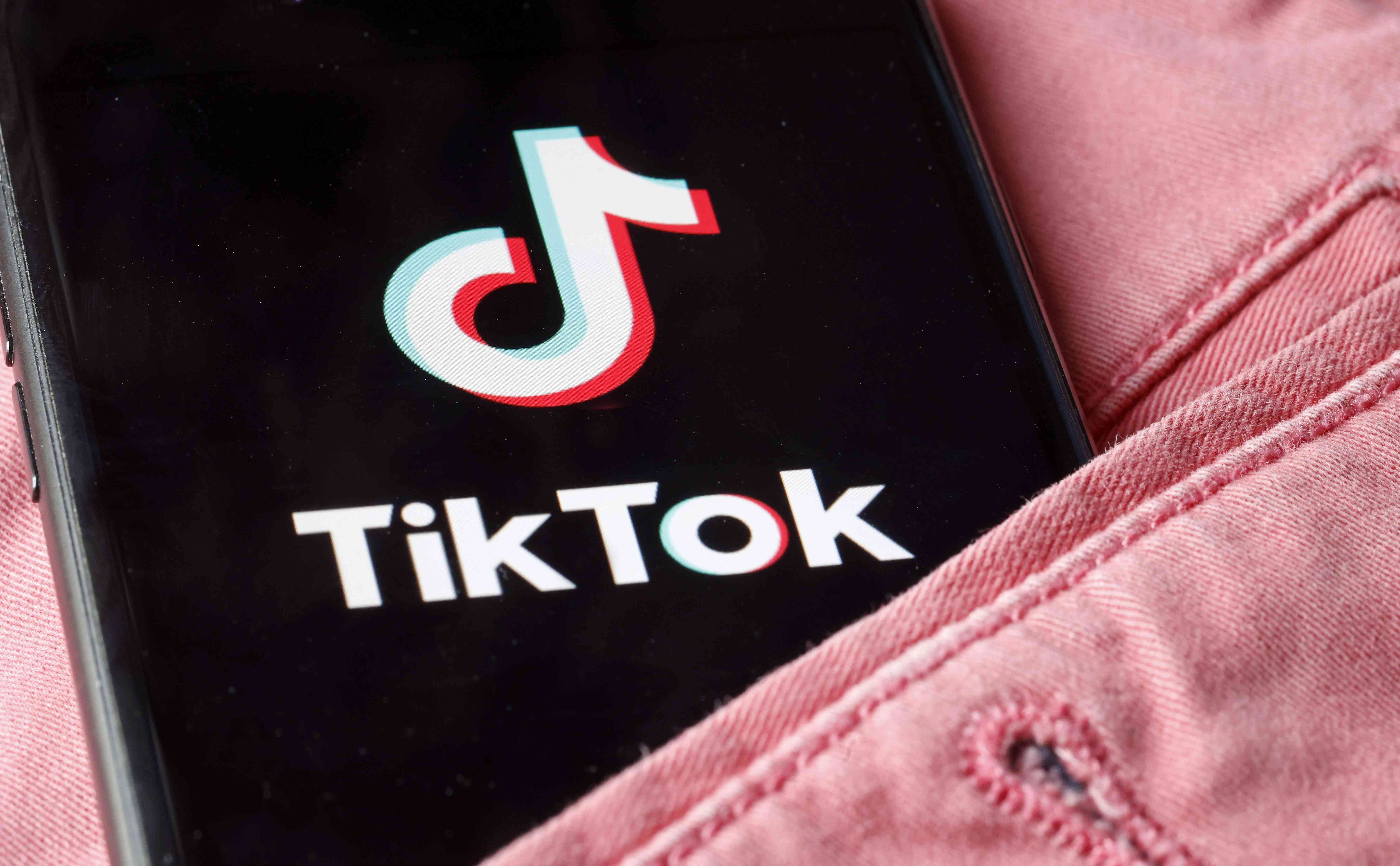 The home page of the social media application TikTok is displayed on the screen of an iPhone on April 24, 2024