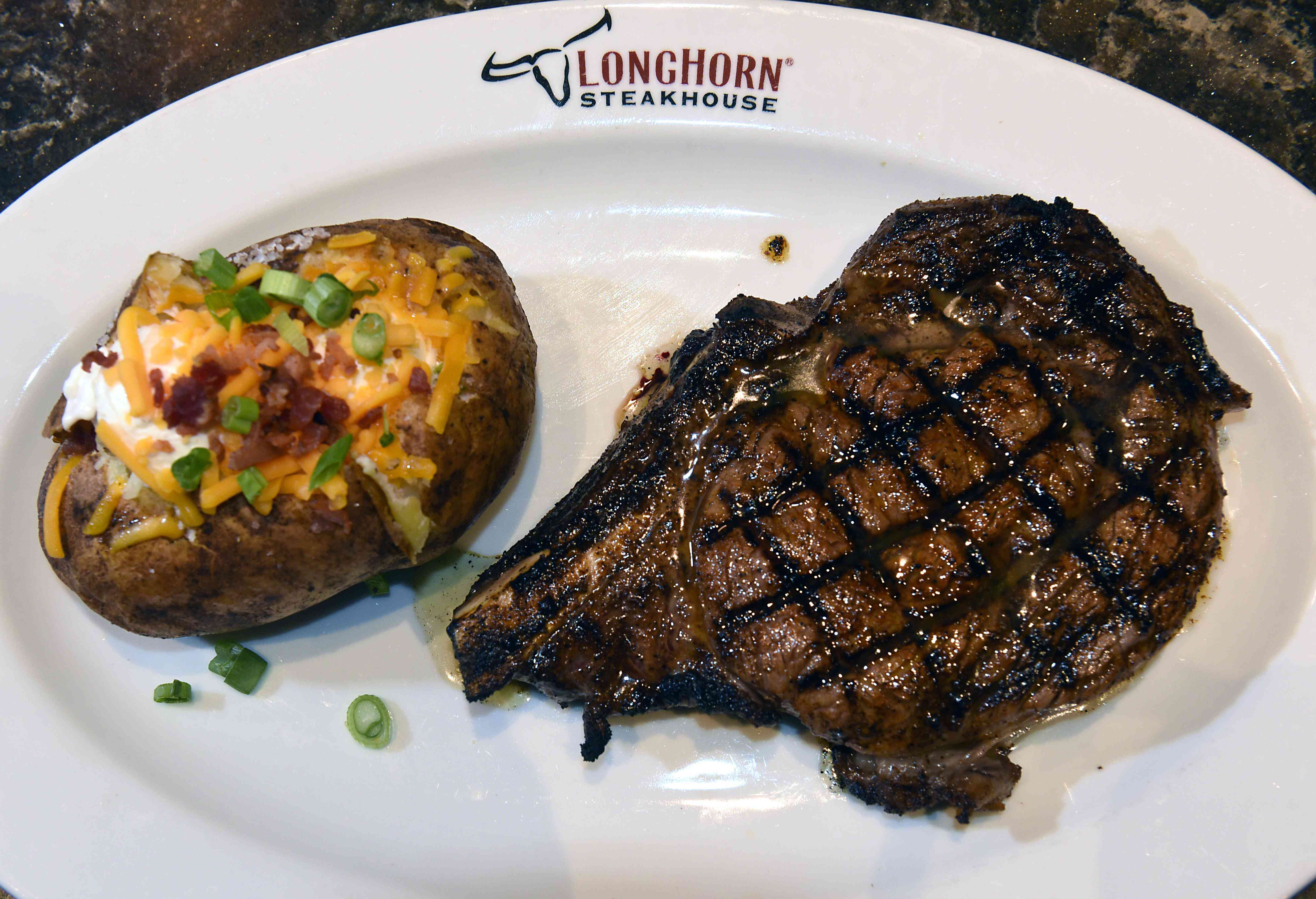 Outlaw ribeye with Idaho potato at LongHorn Steakhouse on Jan. 6, 2020 in Colonie, N.Y.