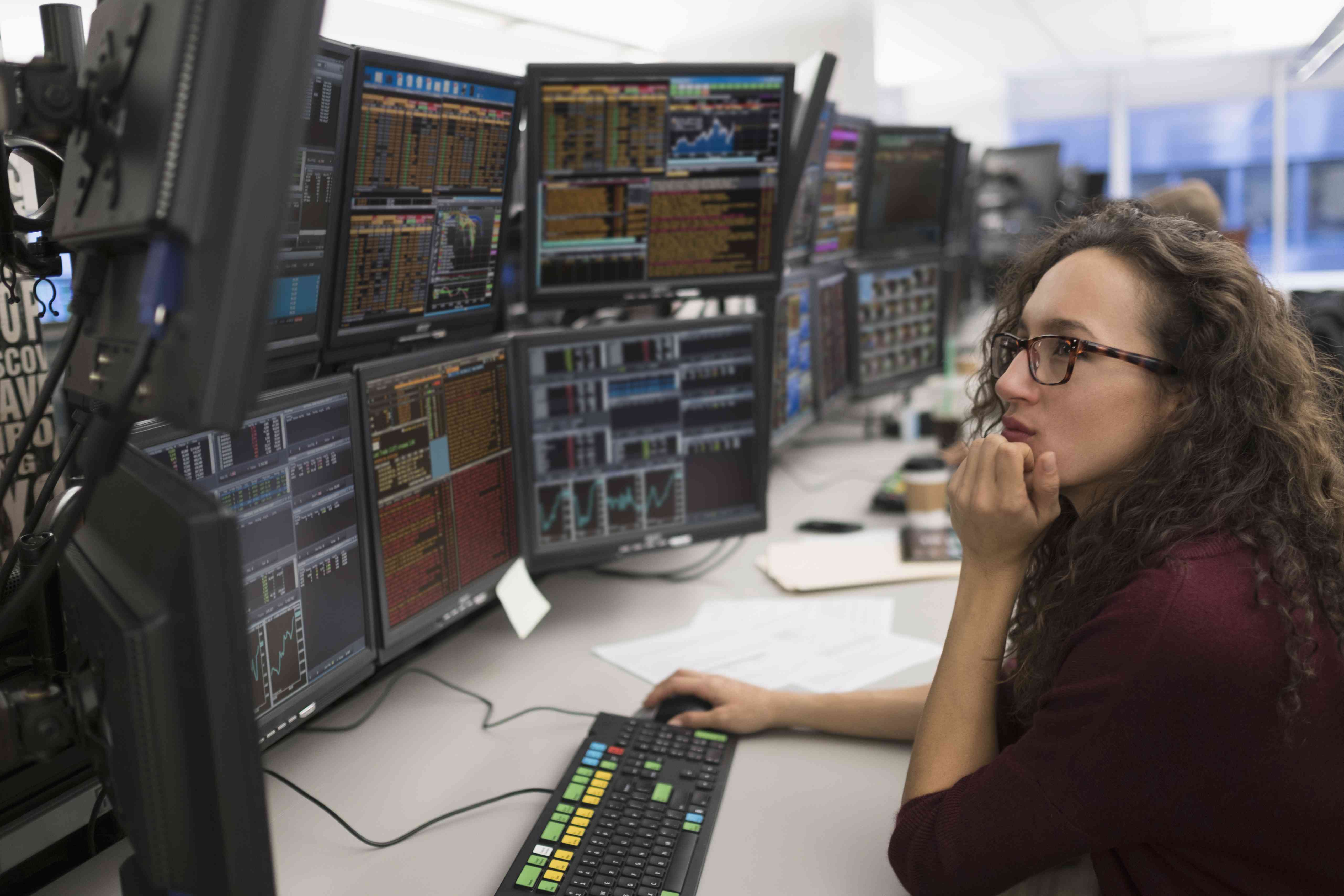 Young woman analyzing computer data