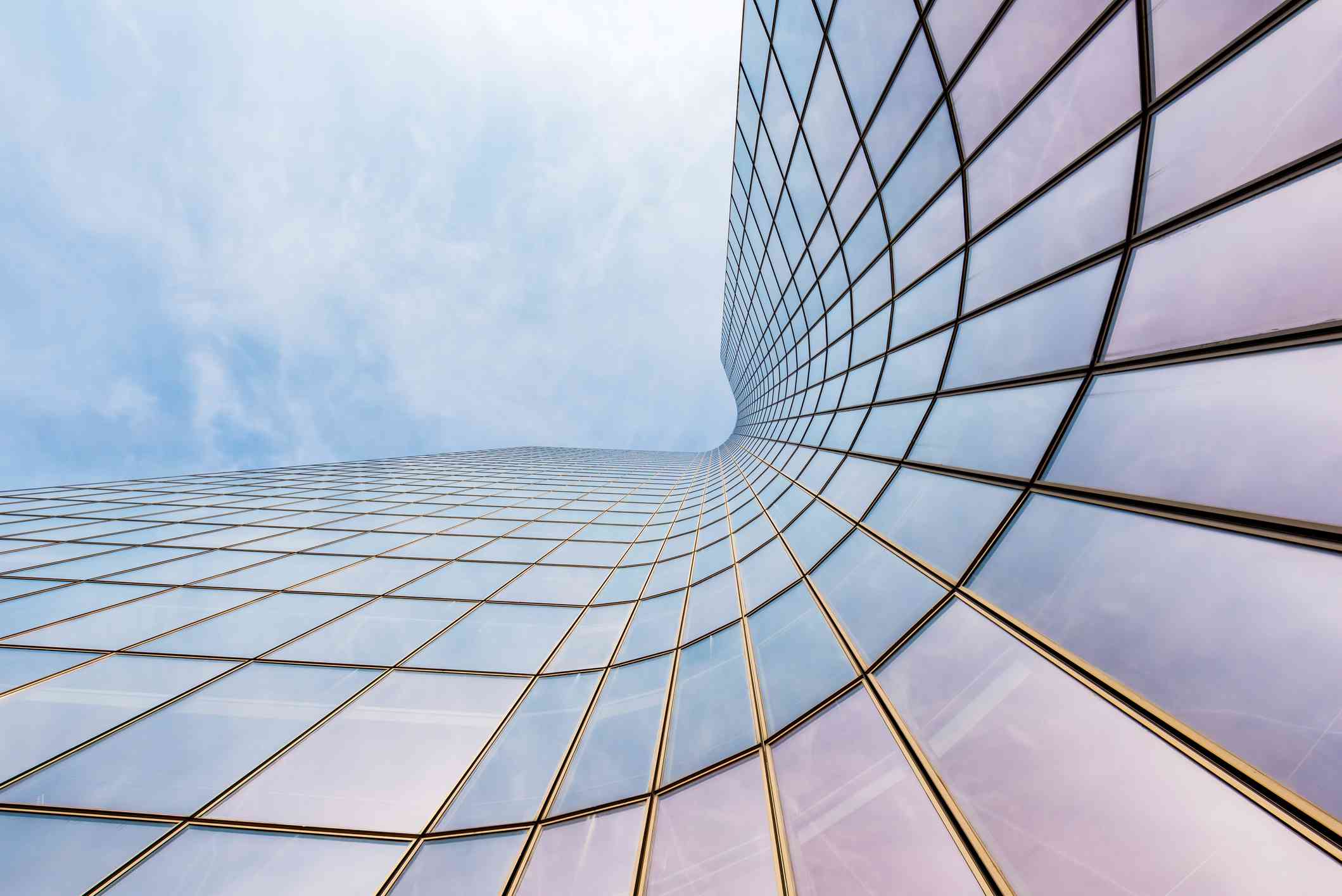 curved skyscraper on blue sky