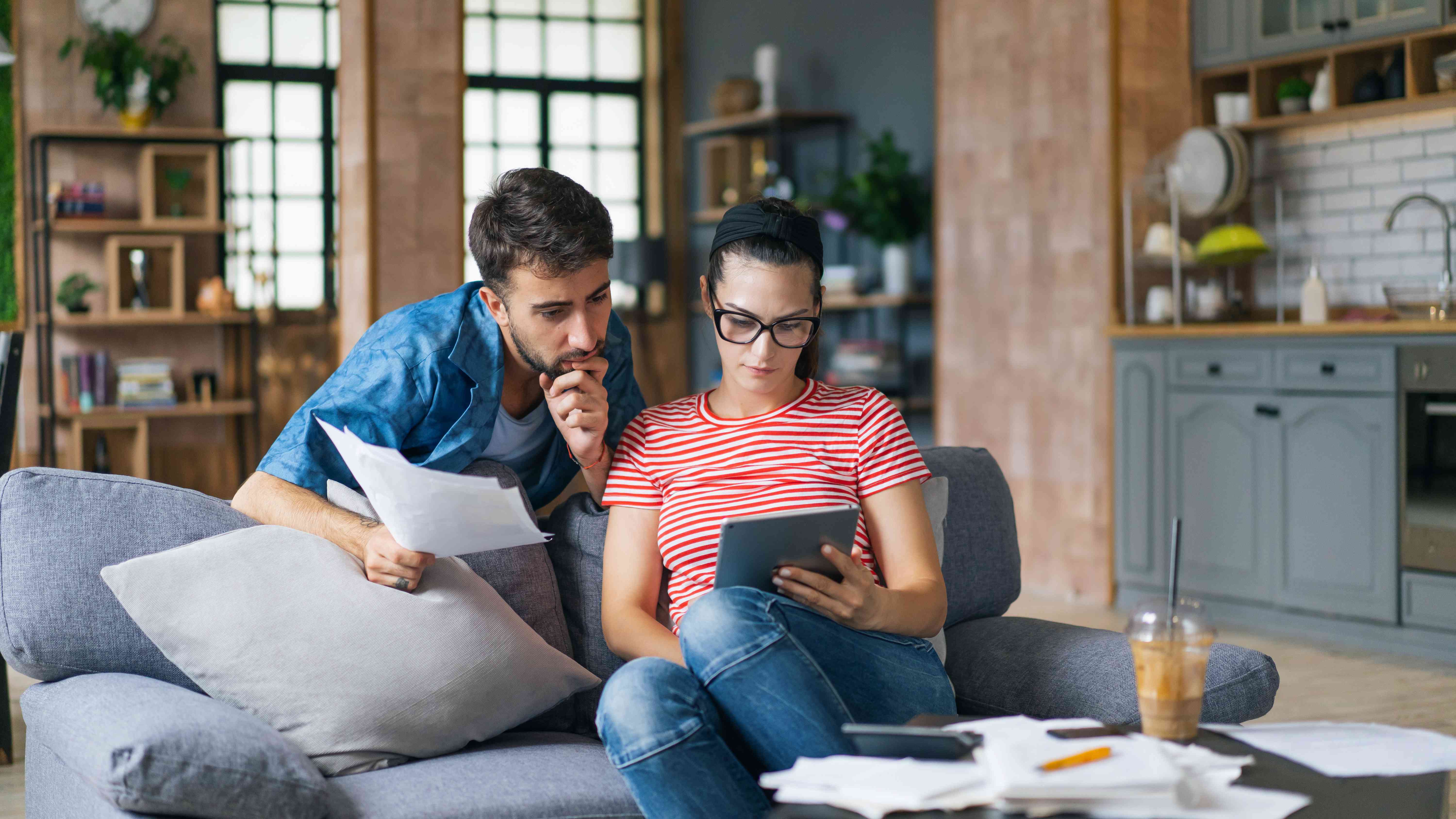 Young couple studying iPad together