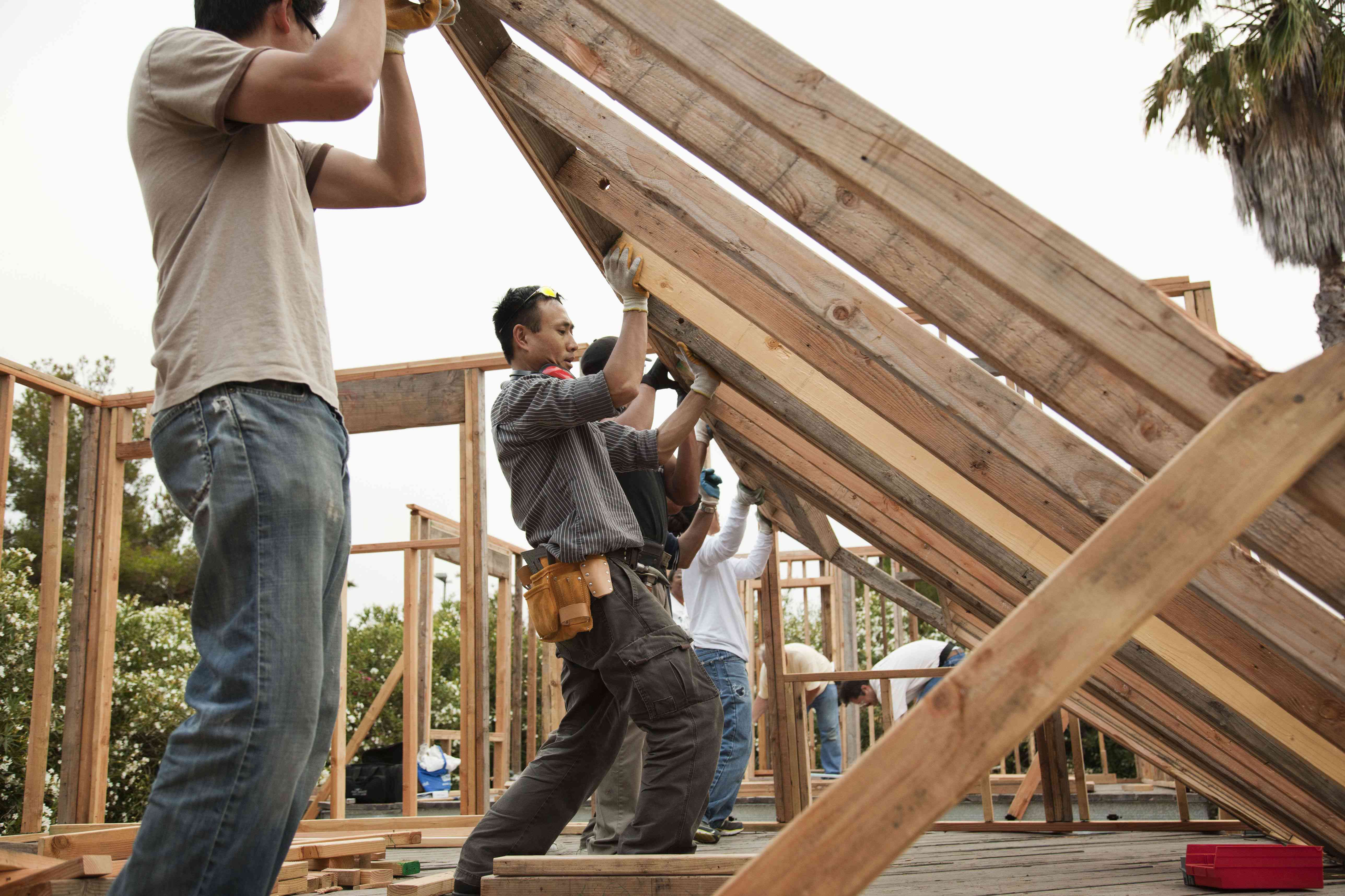 Construction workers framing a new house