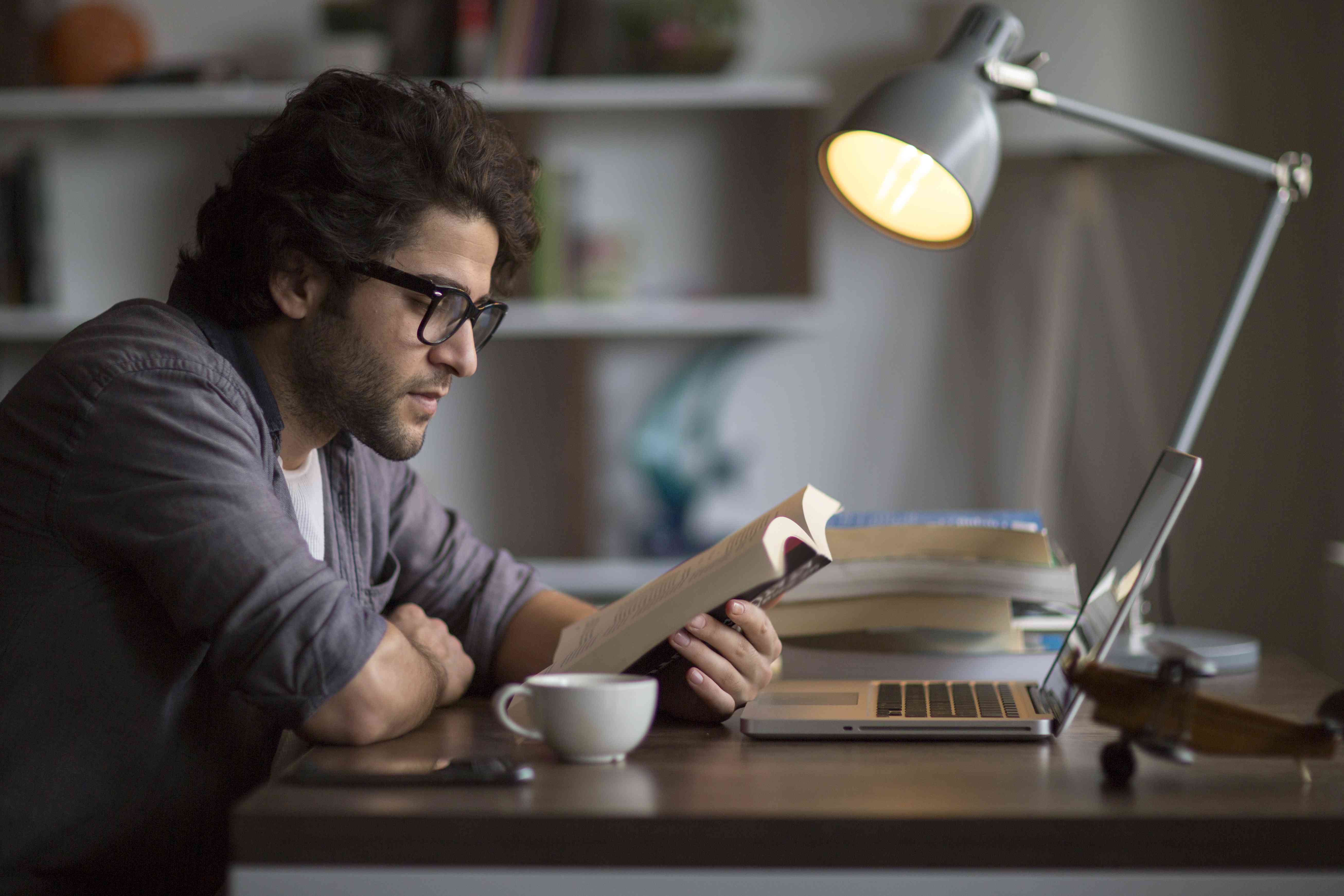 Man reading about student loan refinancing