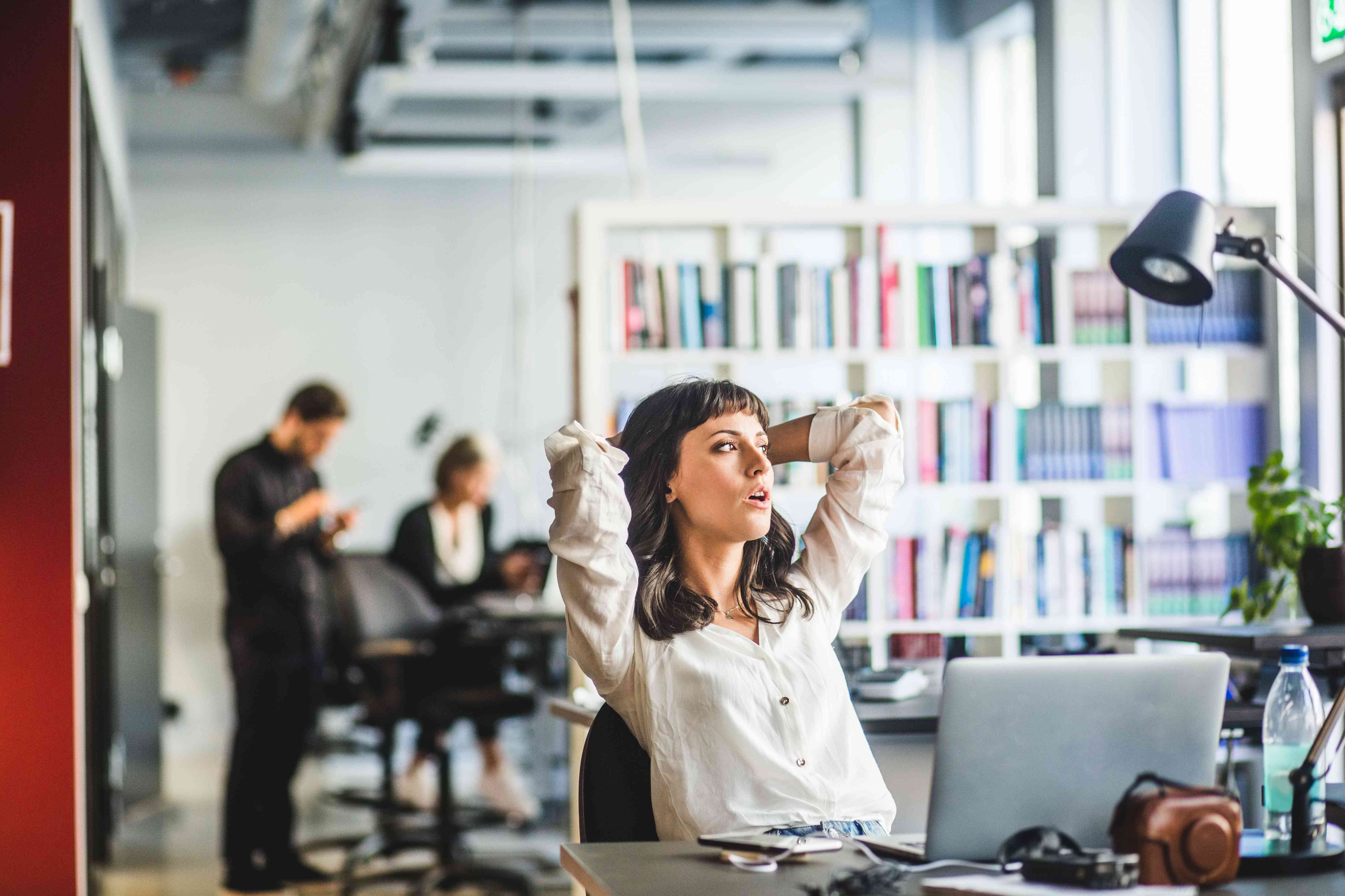 A woman bored in an office