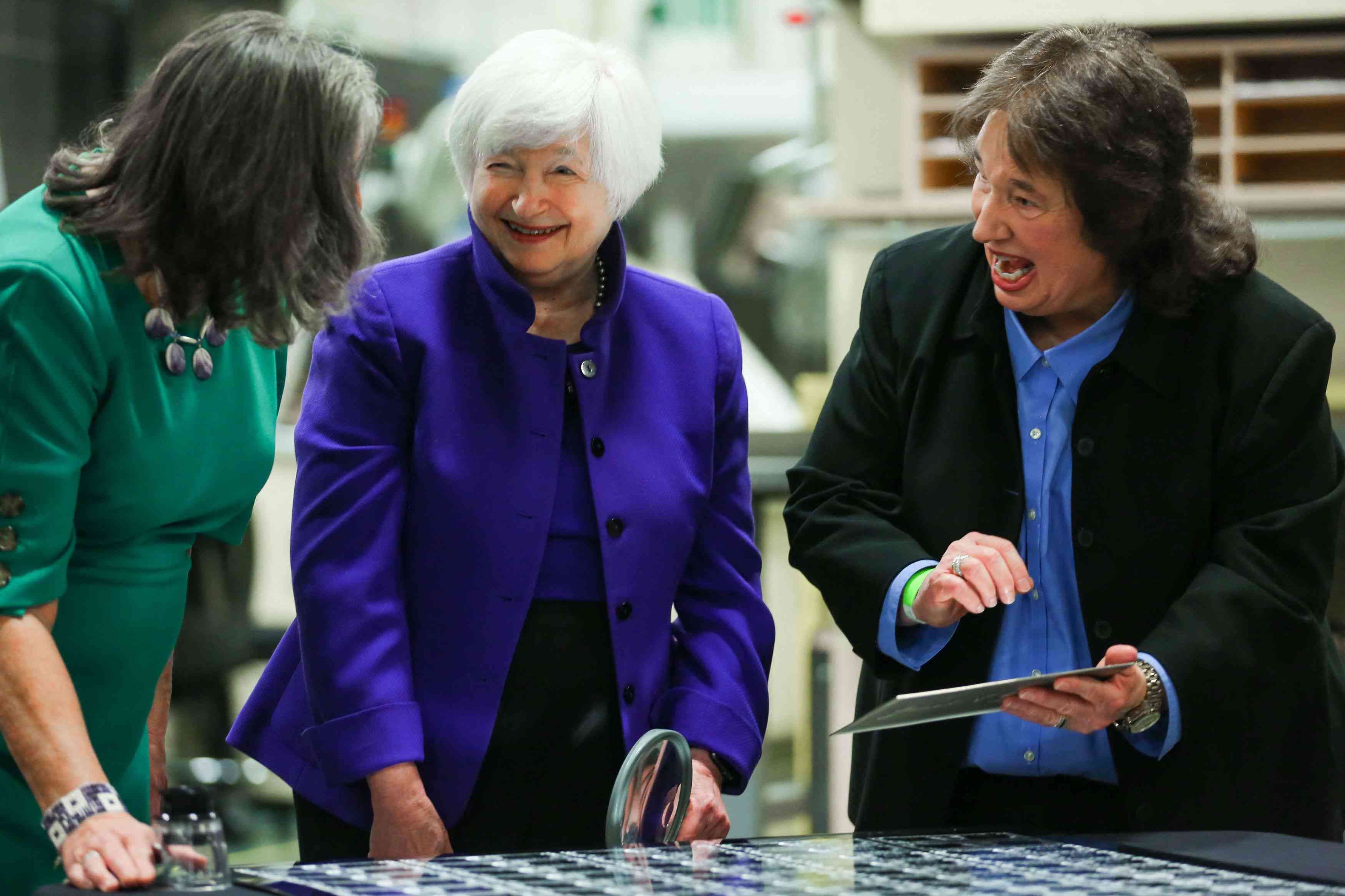 Bureau of Engraving and Printing Deputy Director Charlene Williams (R) shows US Treasury Secretary Janet Yellen (C) and Treasurer Marilynn Malerba a printing plate with Yellens and Malerba's signatures at the Bureau of Engraving and Printing Western Currency Facility on December 8, 2022 in Fort Worth, Texas. 