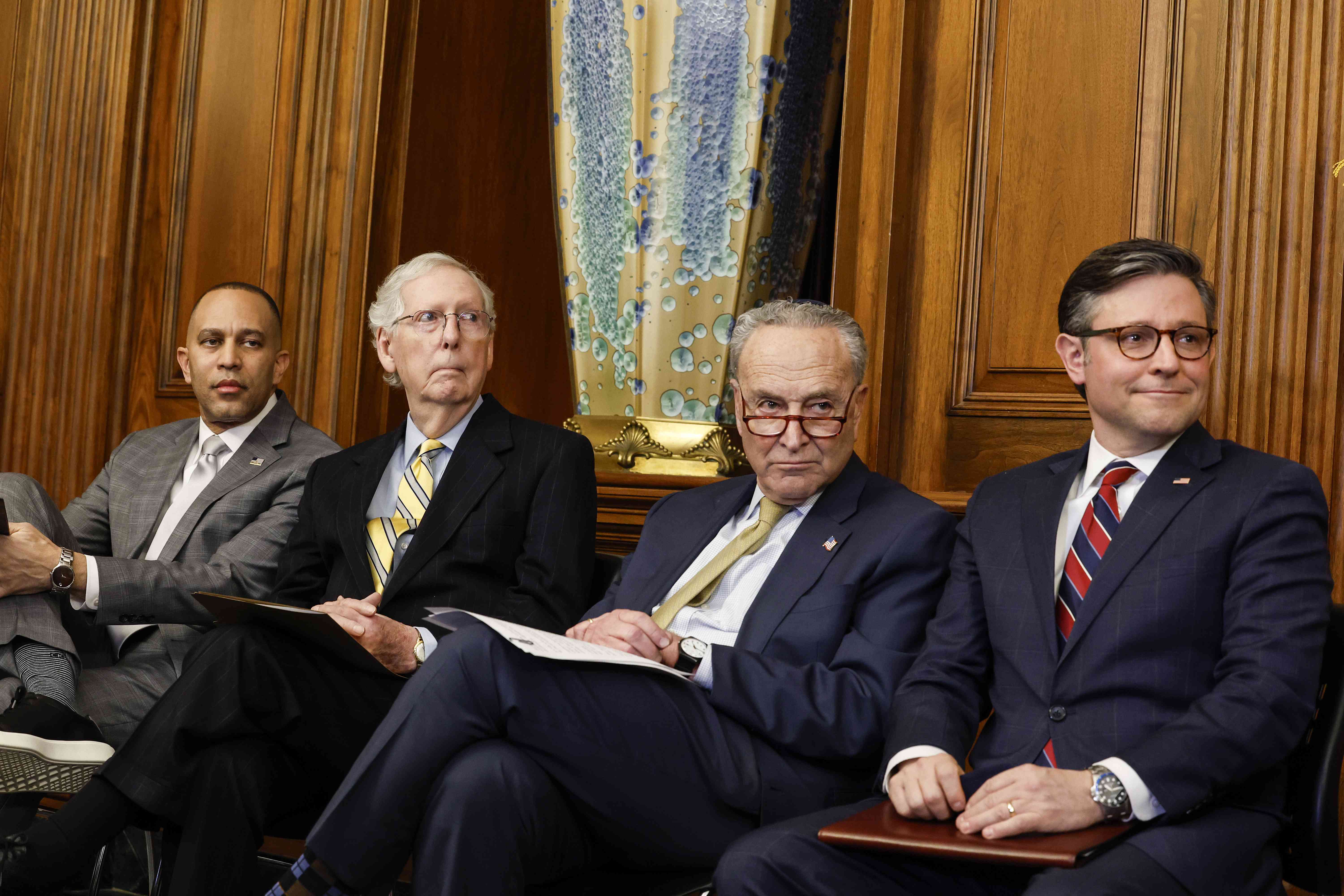 U.S. House Minority Leader Hakeem Jeffries (D-New York), U.S. Senate Minority Leader Mitch McConnell (R-Kentucky), U.S. Senate Majority Leader Chuck Schumer (D-New York), and U.S. Speaker of the House Mike Johnson (R-Louisiana) listen during during remarks at a Capitol Menorah lighting ceremony at the U.S. Capitol Building on Dec. 12, 2023, in Washington, D.C. 