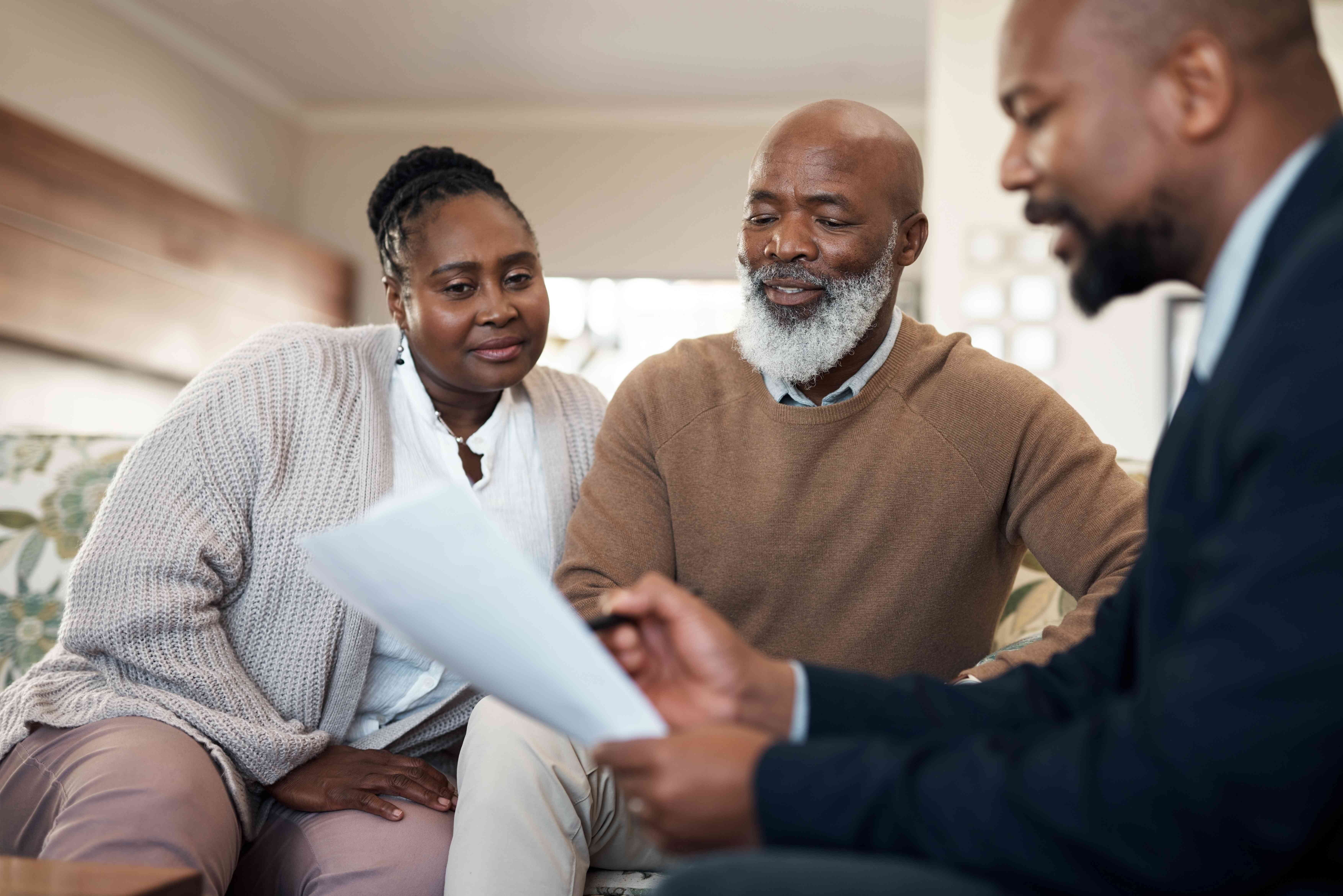 Couple listening to their financial advisor 