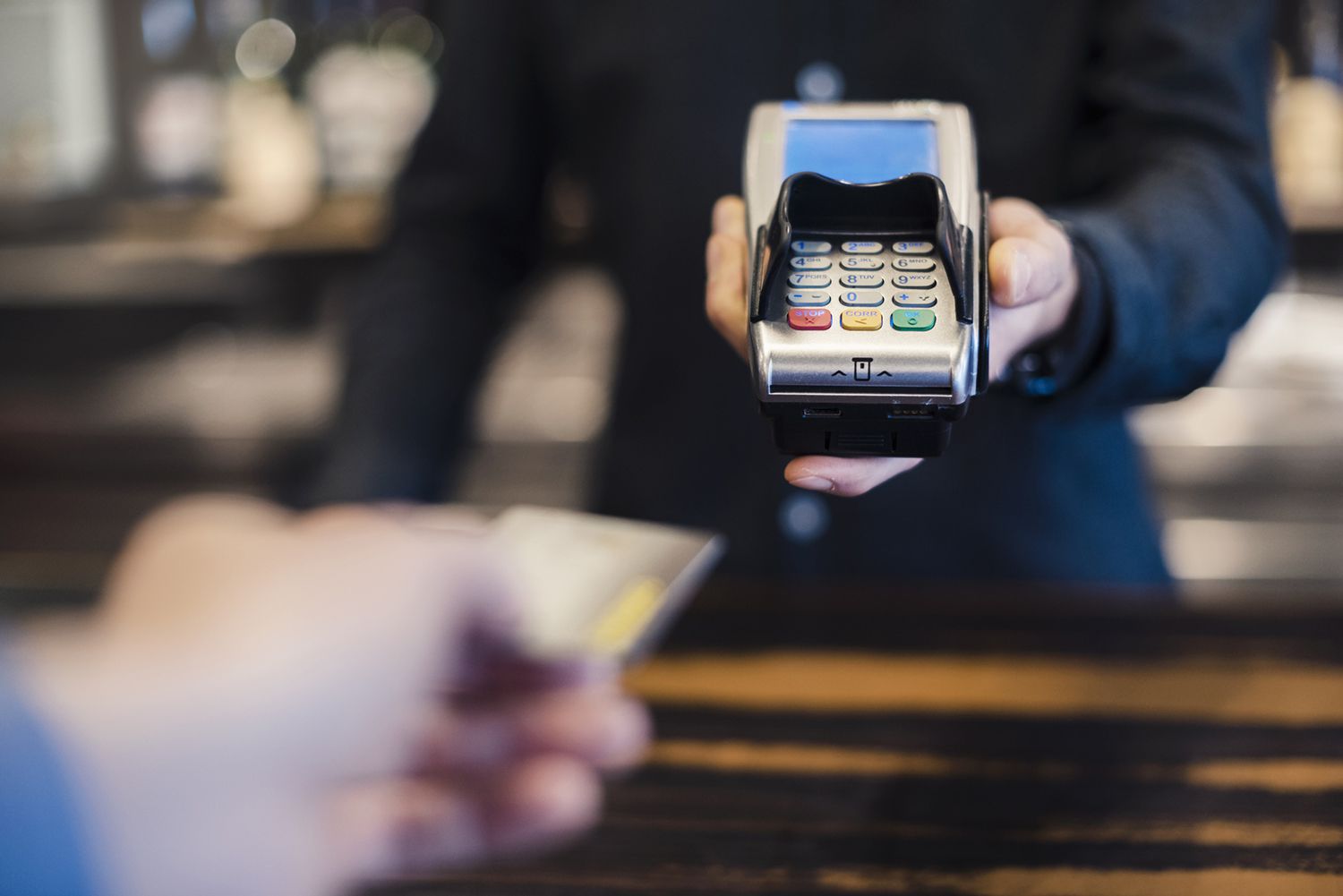 Man Using Credit Card Reader