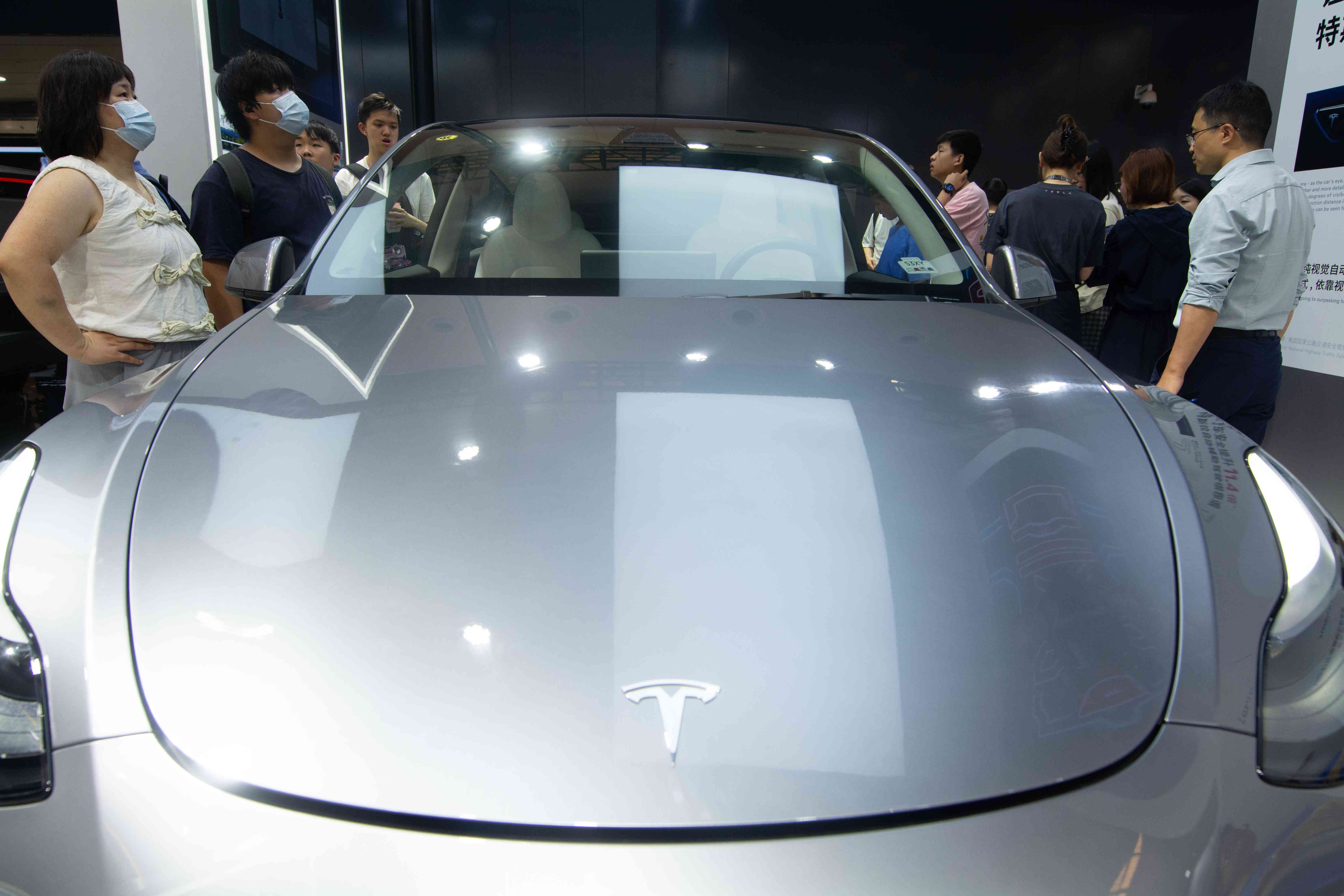 A Tesla car is being displayed at the Tesla stand at the World Artificial Intelligence Conference at the Shanghai World Expo Exhibition Center in Shanghai, China, on July 5, 2024, during the first public viewing day