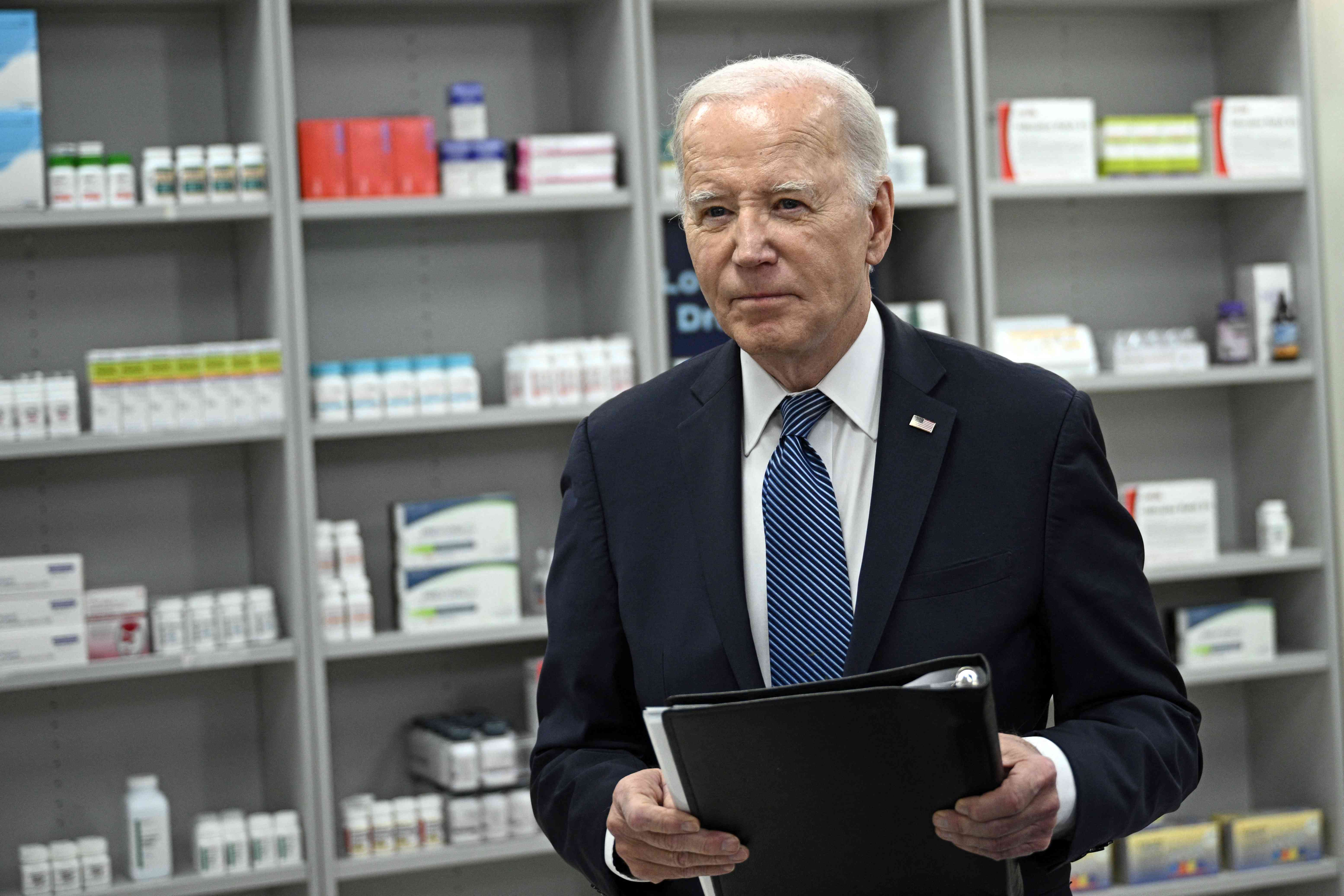 US President Joe Biden leaves after speaking about lowering prescription drug costs at the National Institutes of Health in Bethesda, Maryland, on December 14, 2023. 