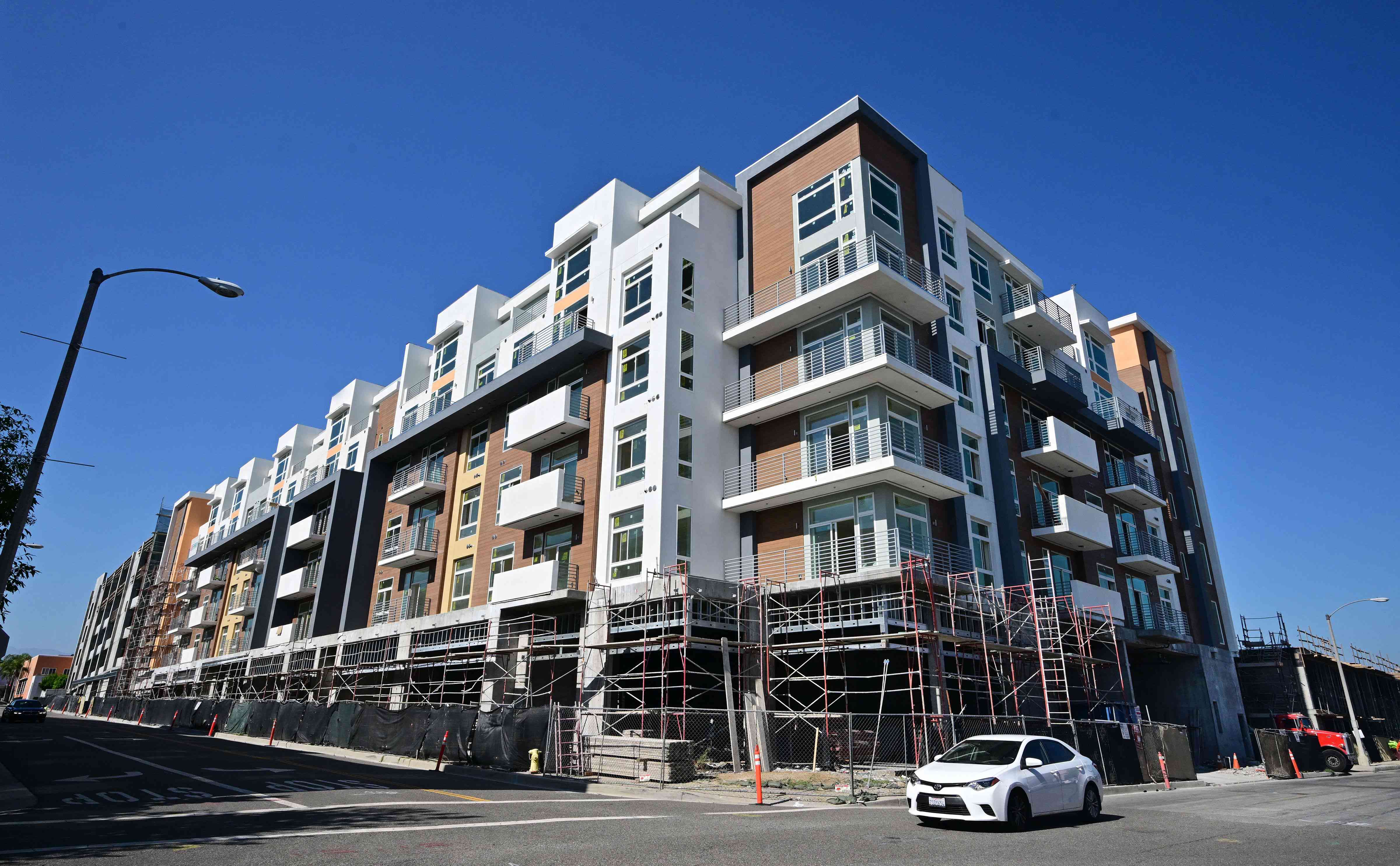 Road side view of an apartment building still under construction