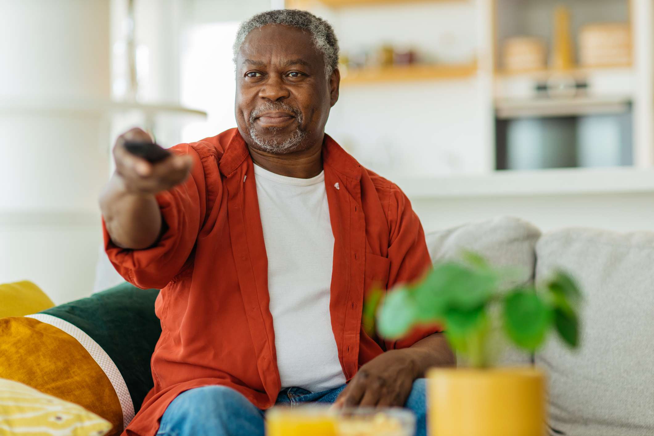 Senior man watching TV