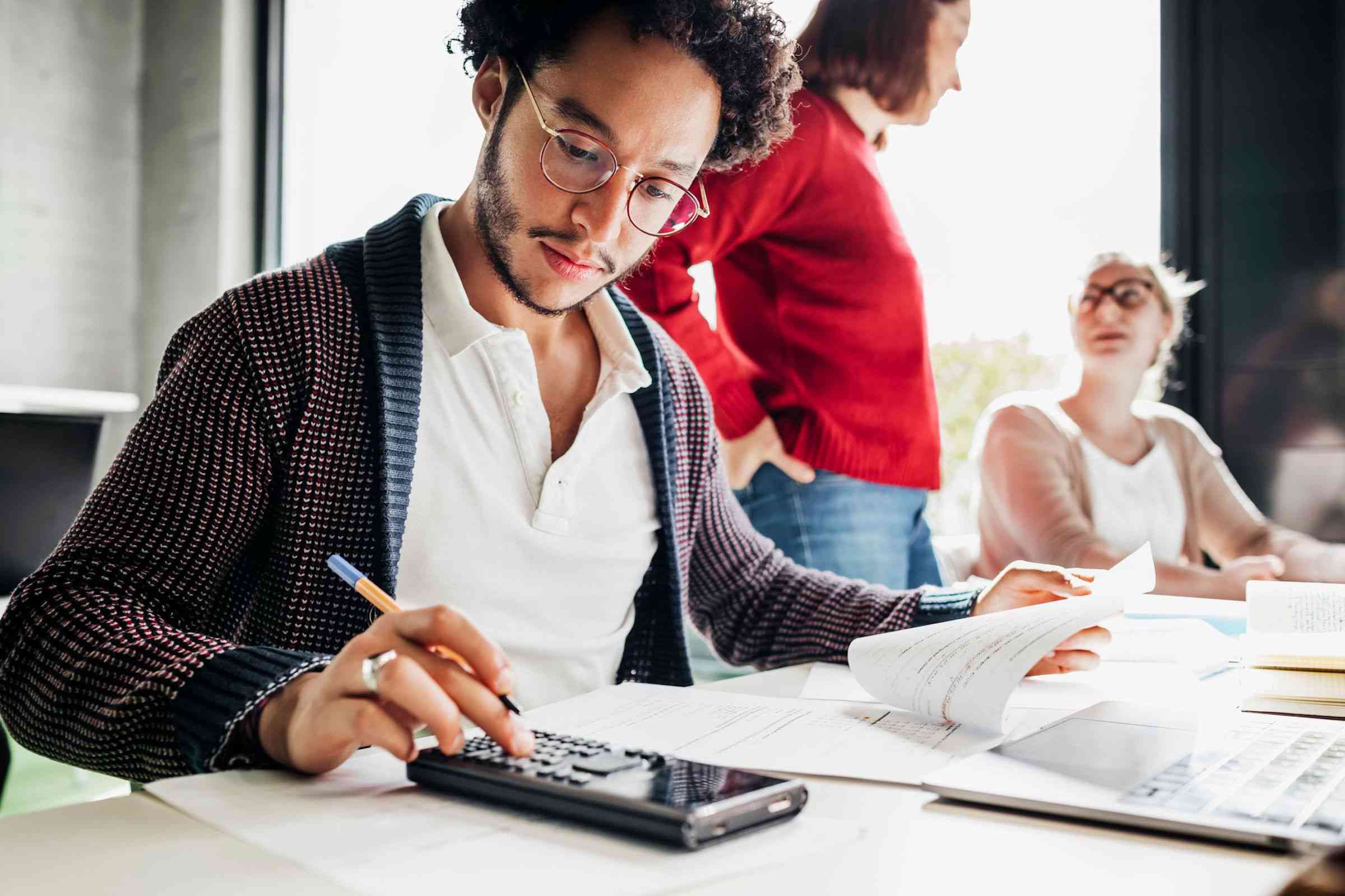 A college student calculates the cost of various student loan repayment plans.