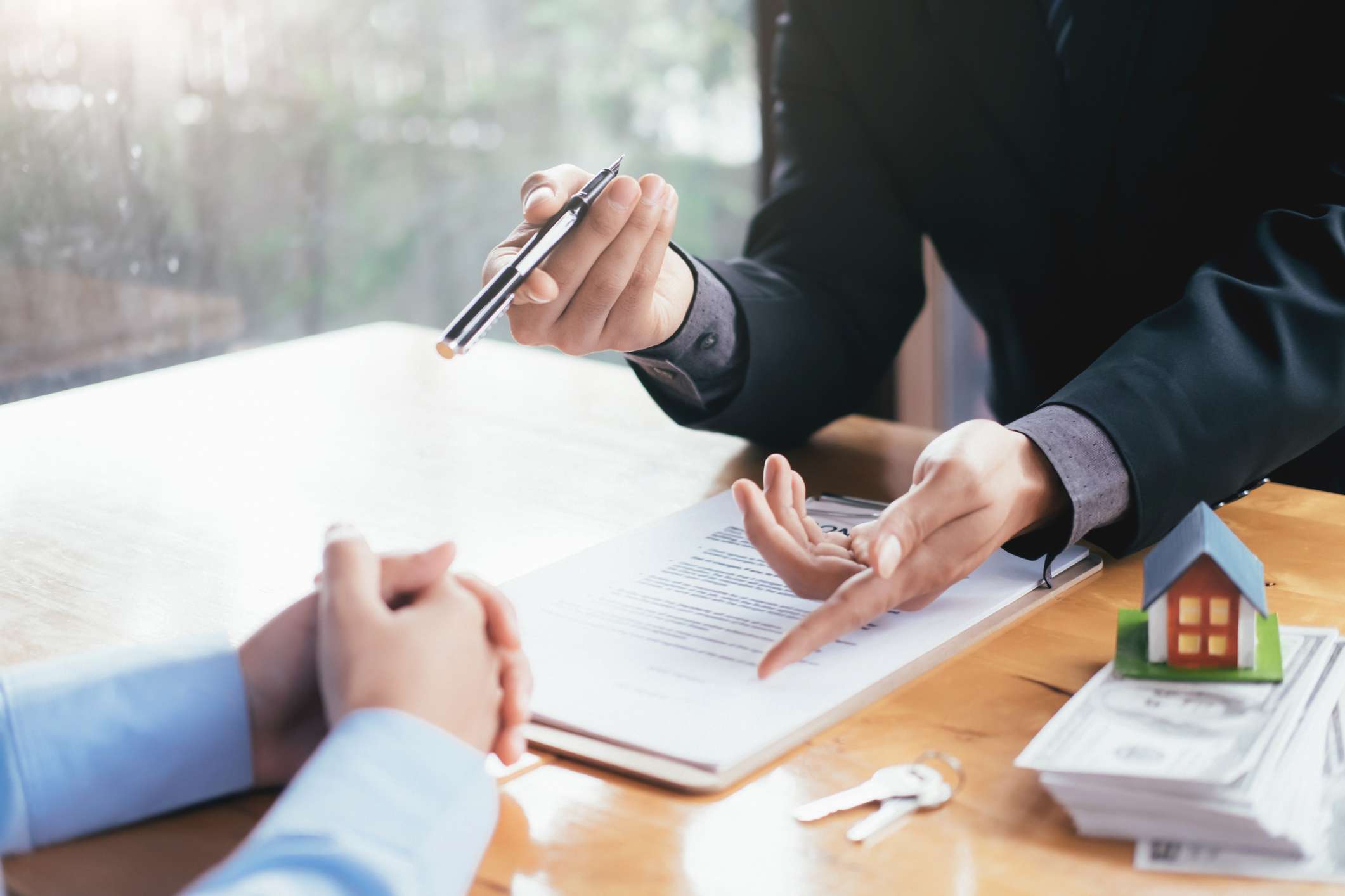 Businessman Giving Document To Client