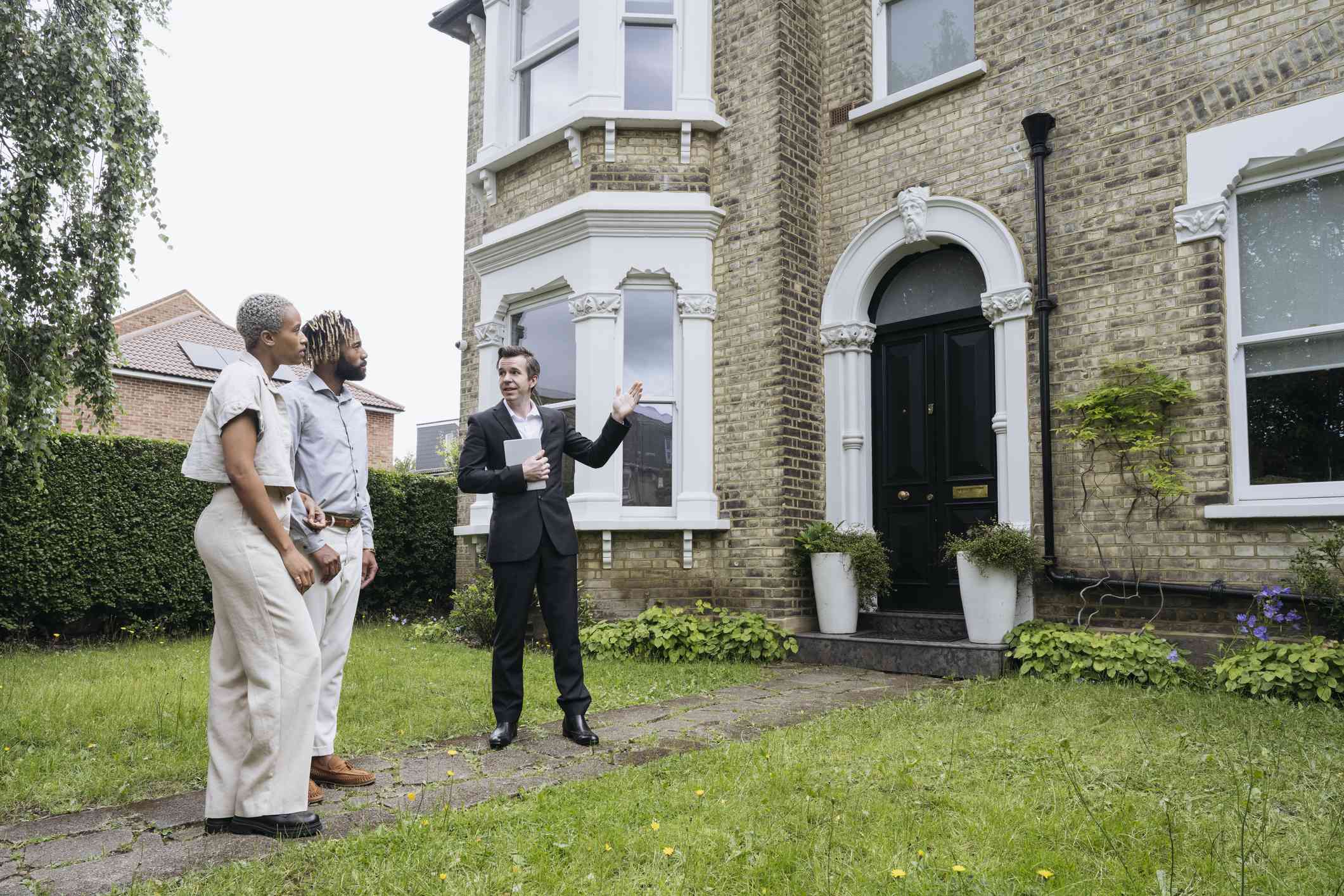 British couple meeting with an estate agent