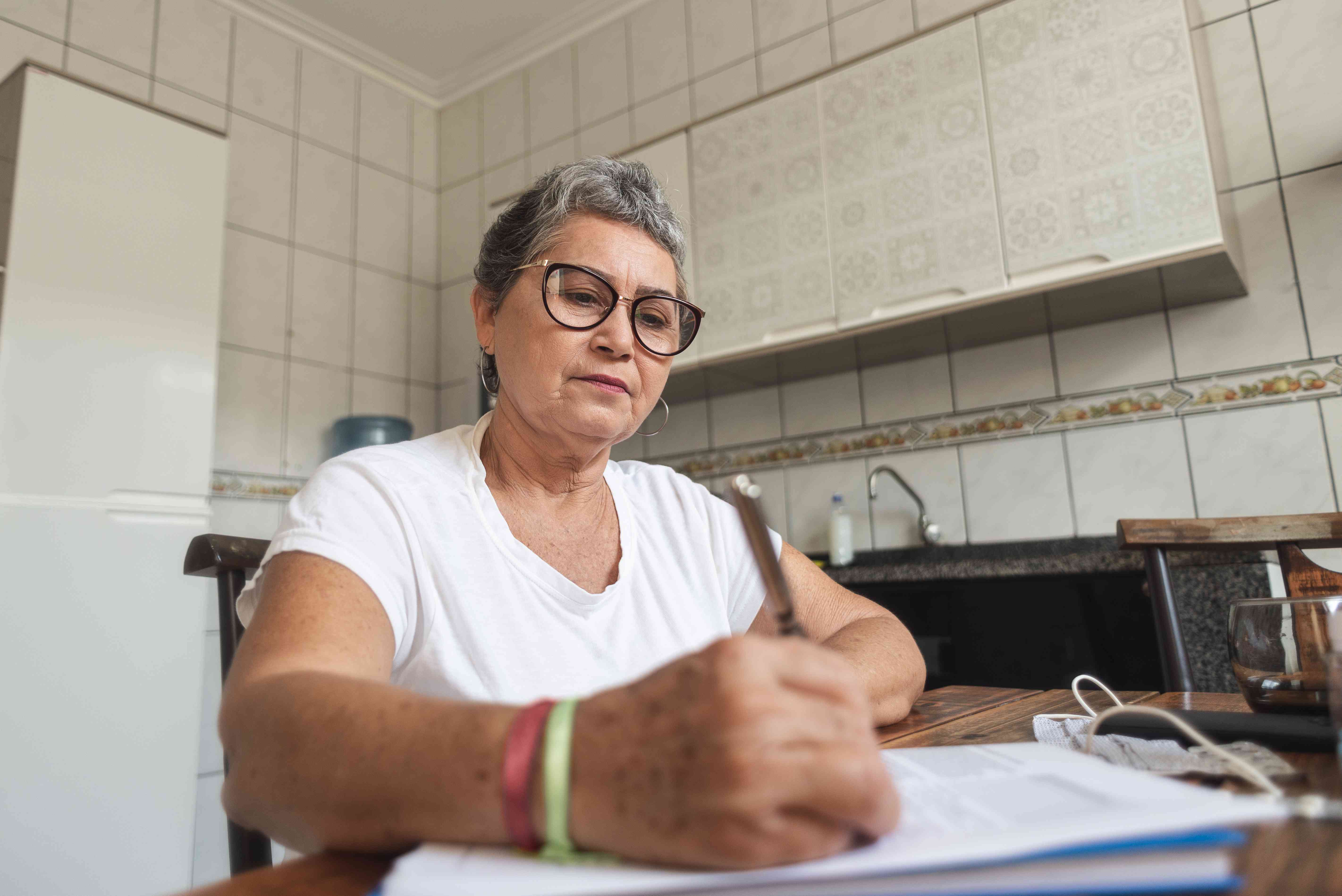 Woman on social security filling out a loan application