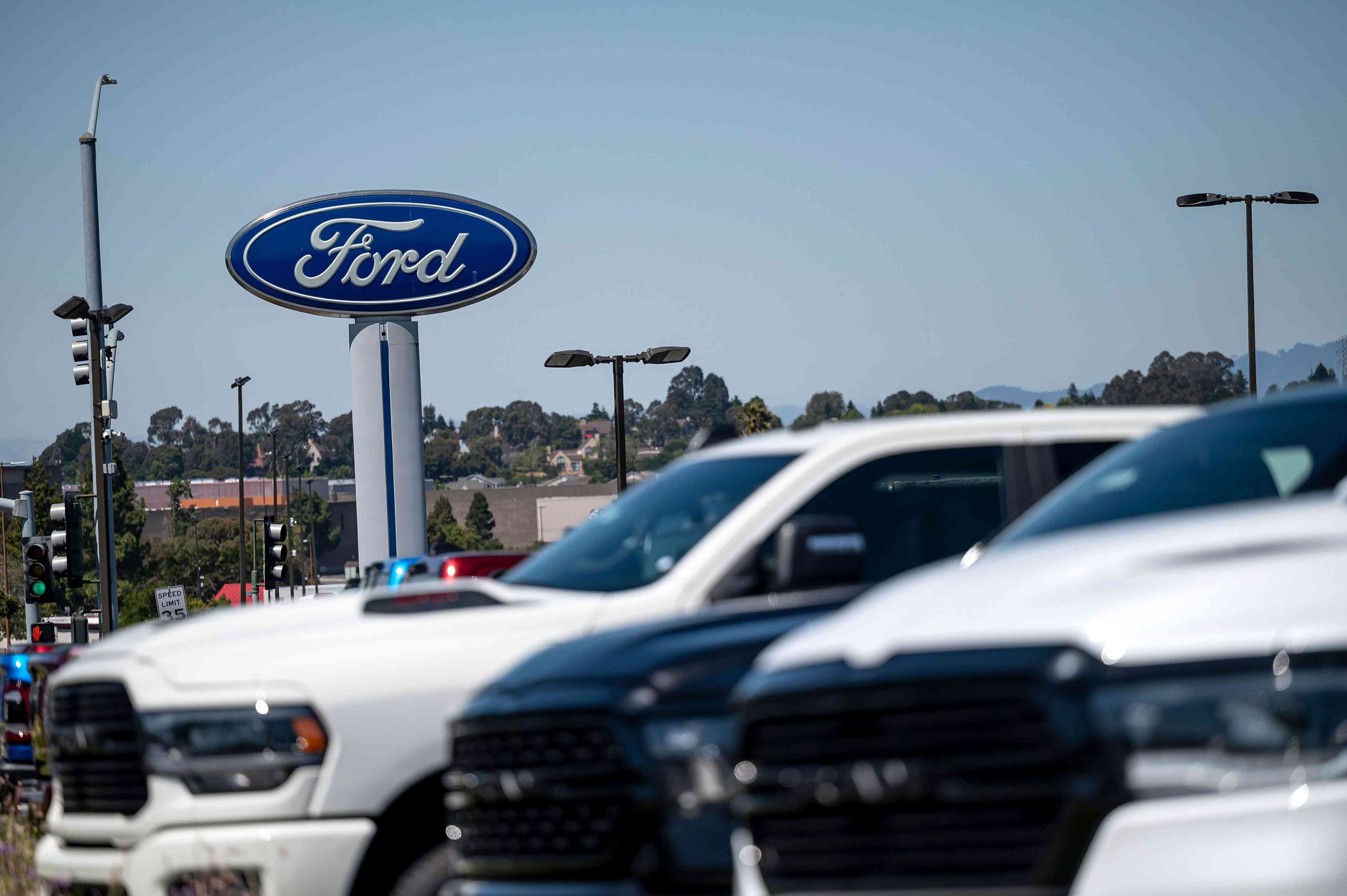 Ford Motor Co. sign over a car lot