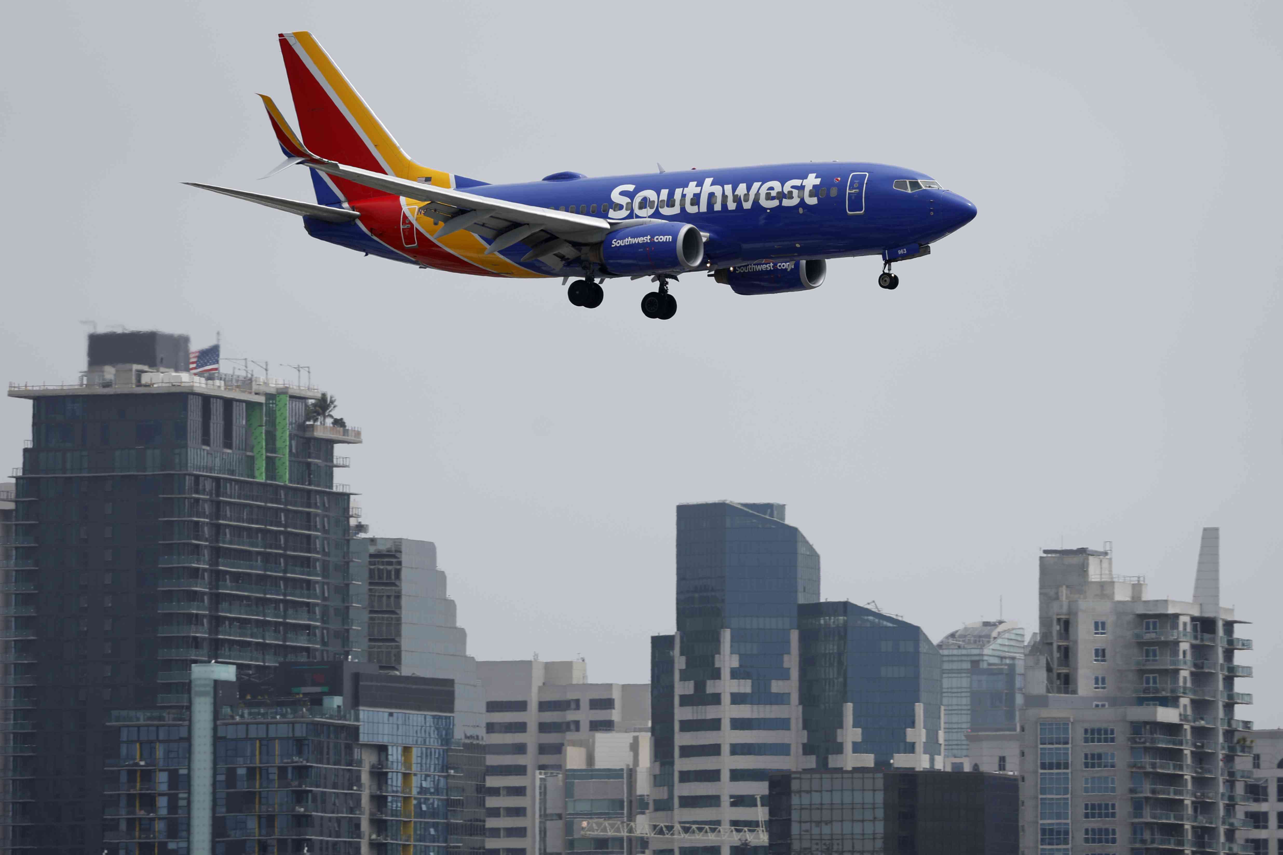 A Southwest Airlines Boeing 737-7H4 approaches San Diego International Airport for a landing from Houston on June 28, 2024 in San Diego, California