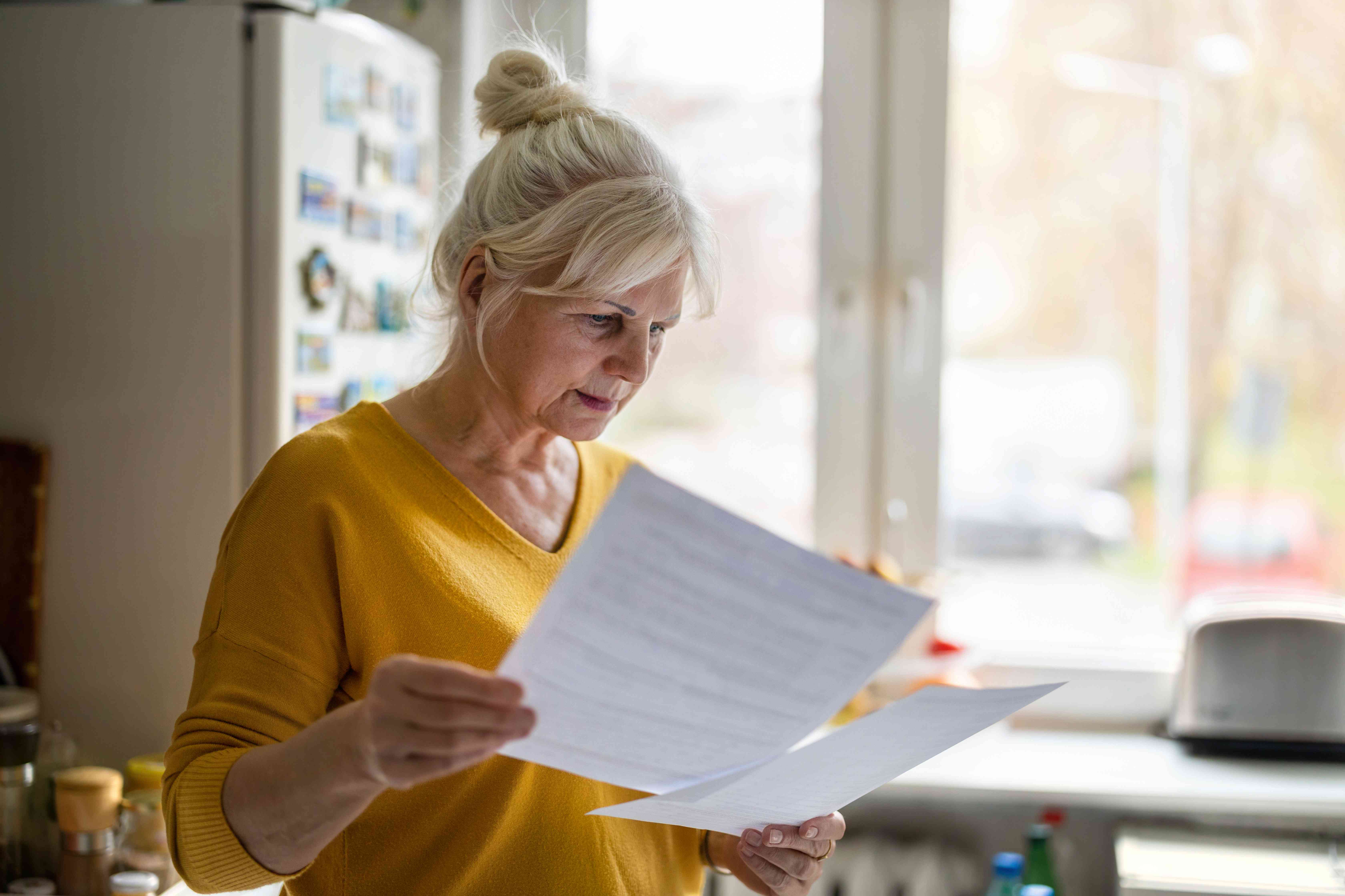 Woman looks over a credit denial