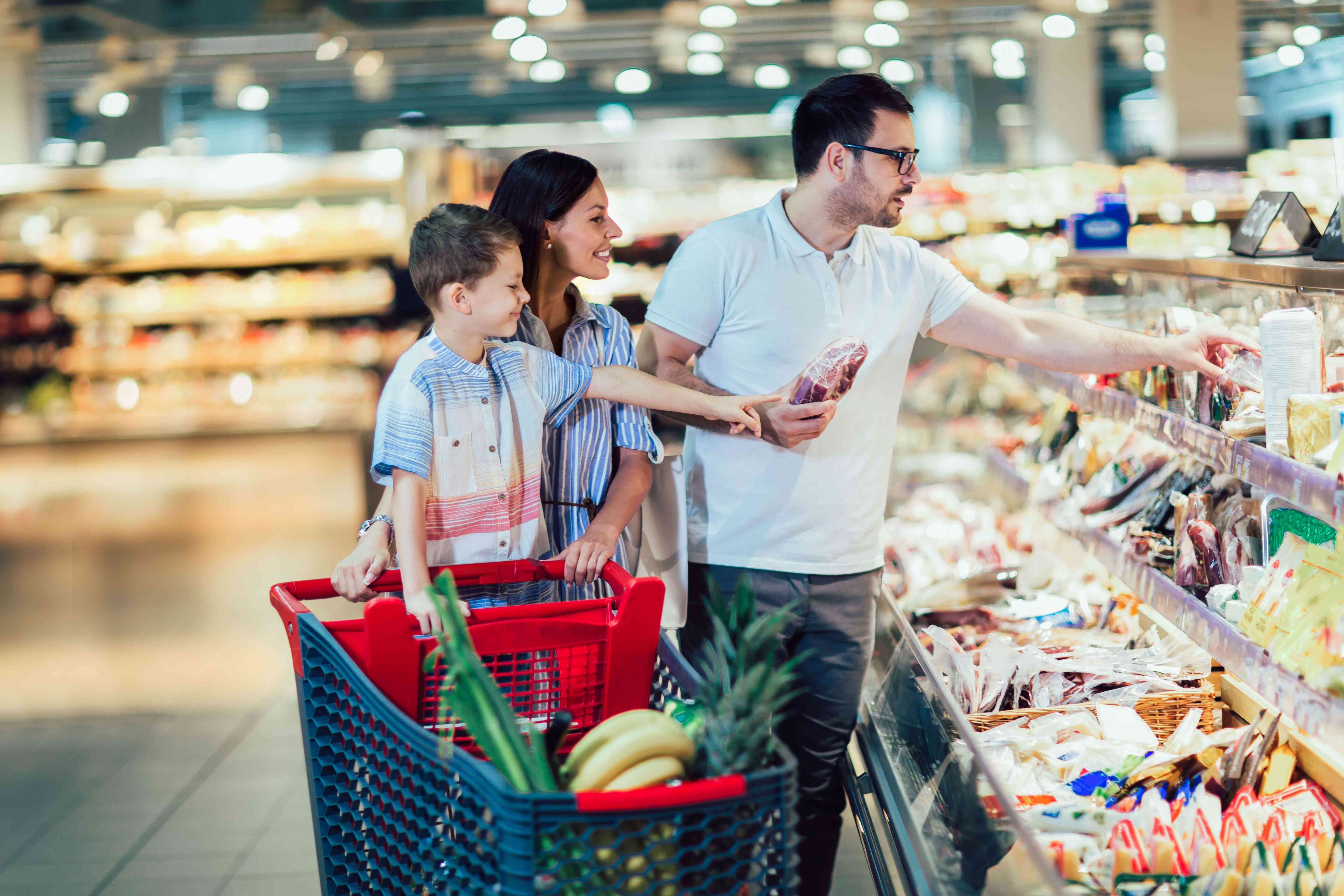 A family shopping in a grocery store