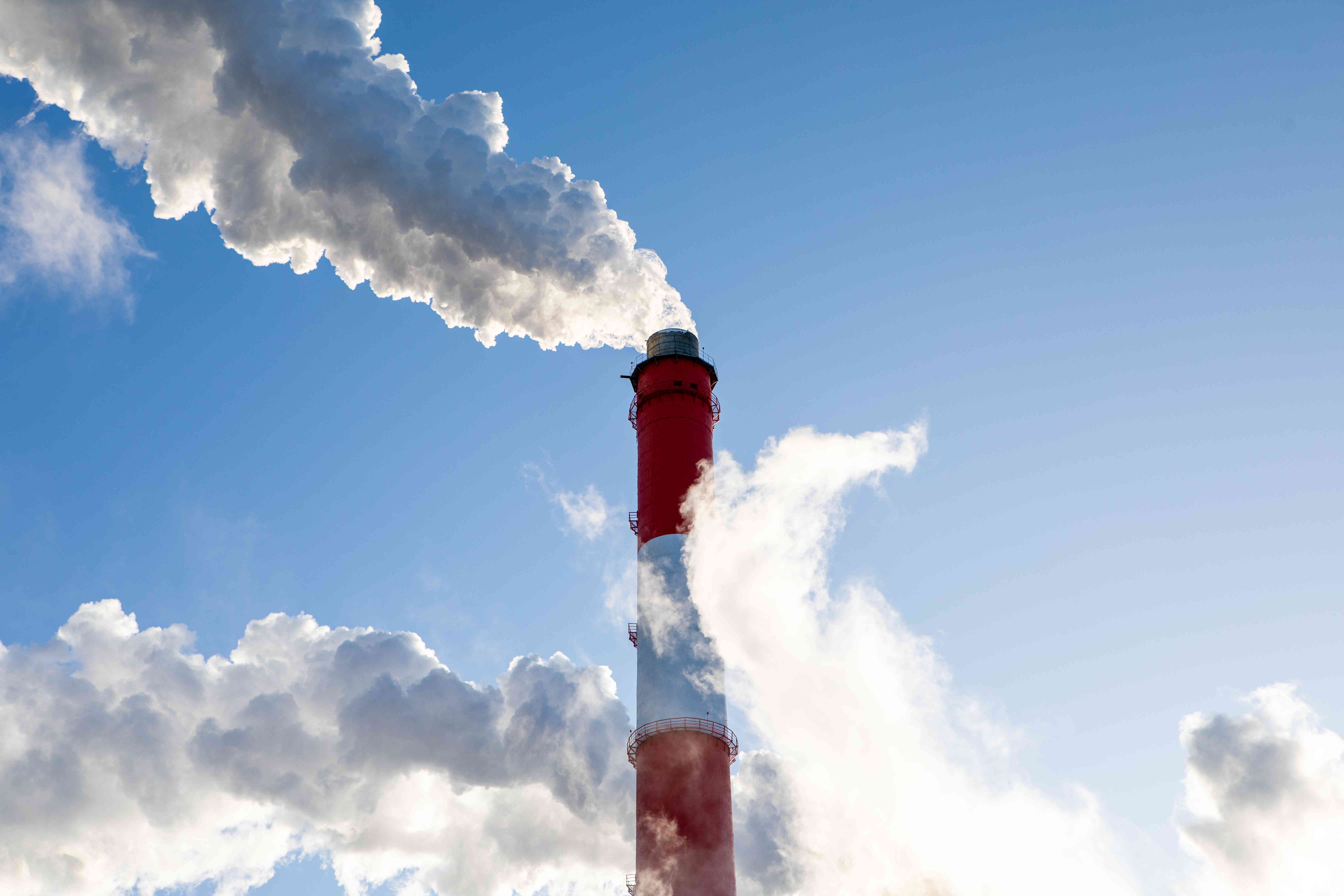 Emissions from the smokestack of a natural gas and coal power plant that are harmful to the atmosphere