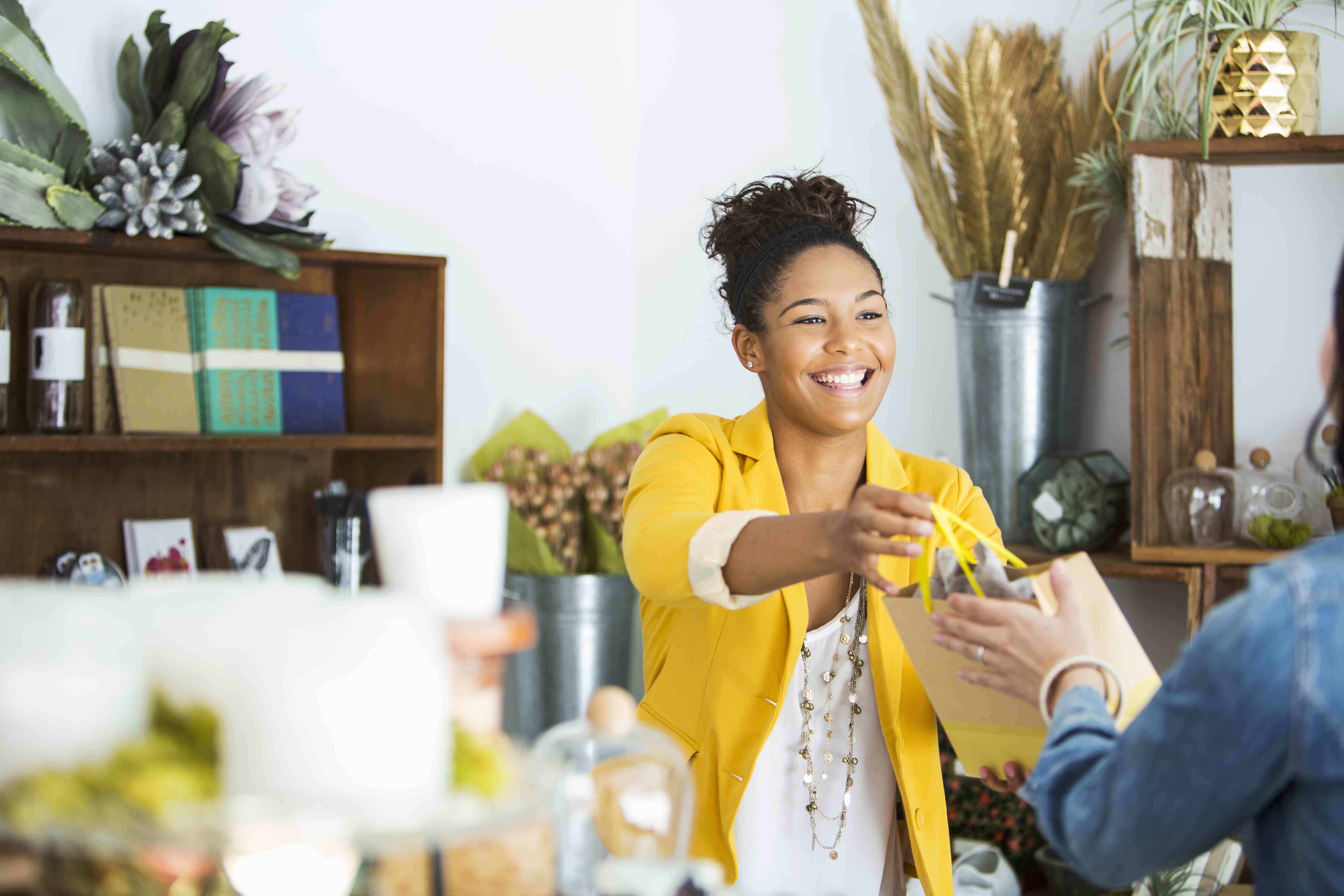 A young employee assists a customer.