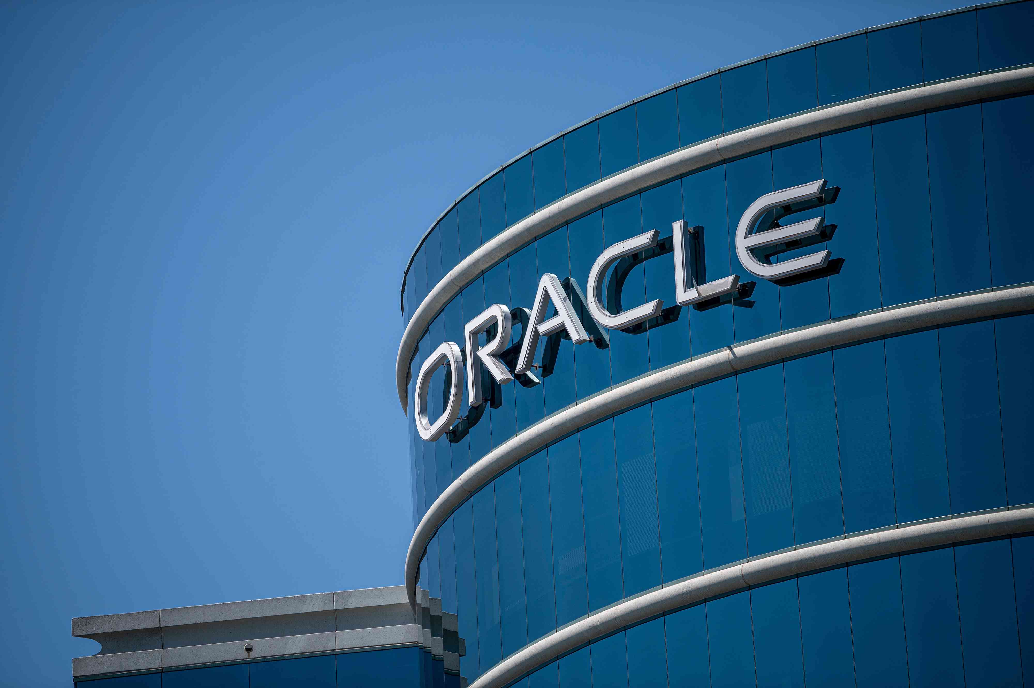 The Oracle logo on display at a company office building.