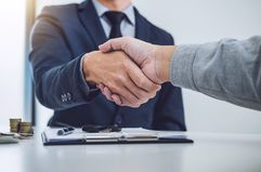 An image of a handshake between two business people.