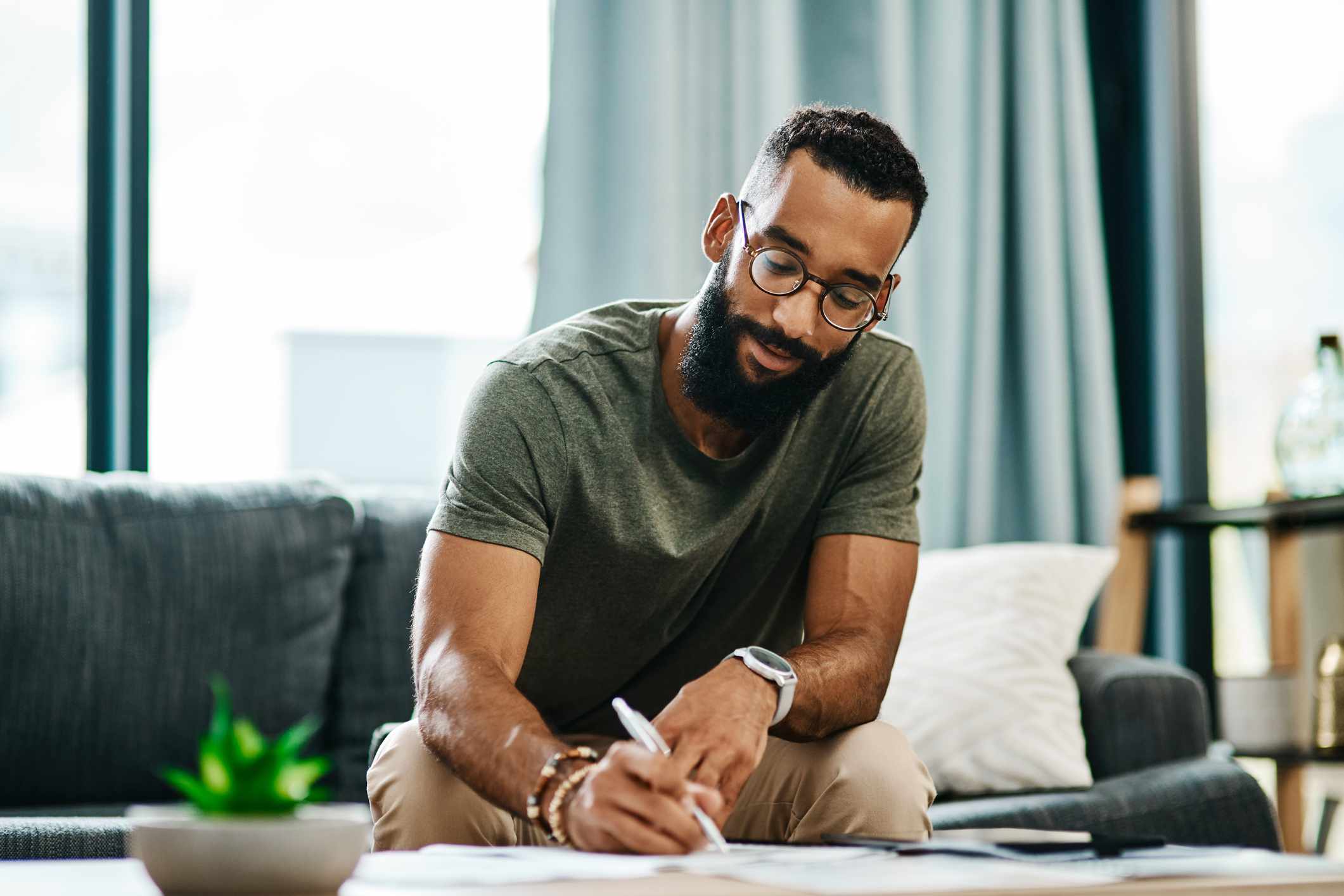 A man fills out paperwork.