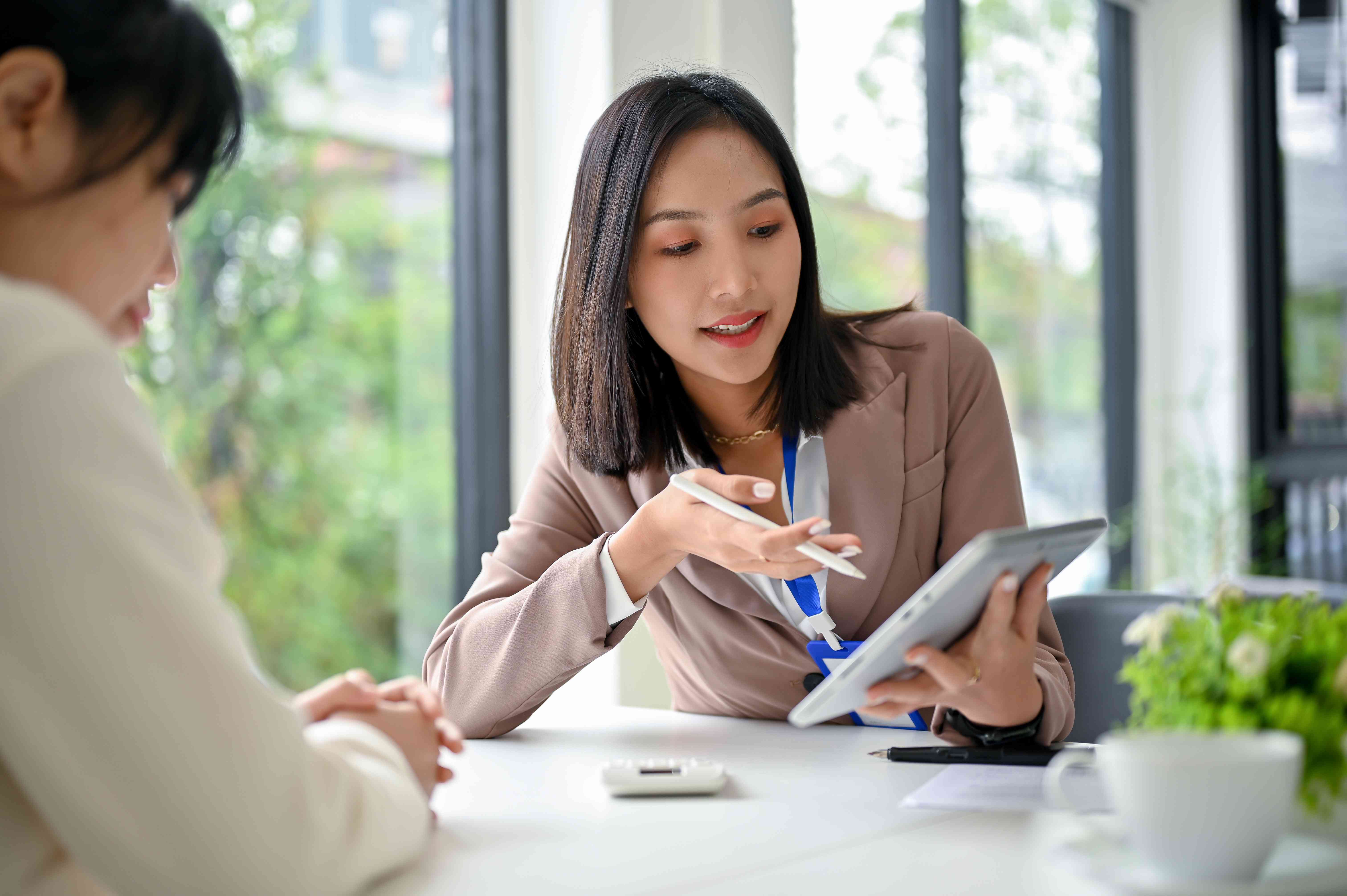 Lender goes over personal loan contract with client