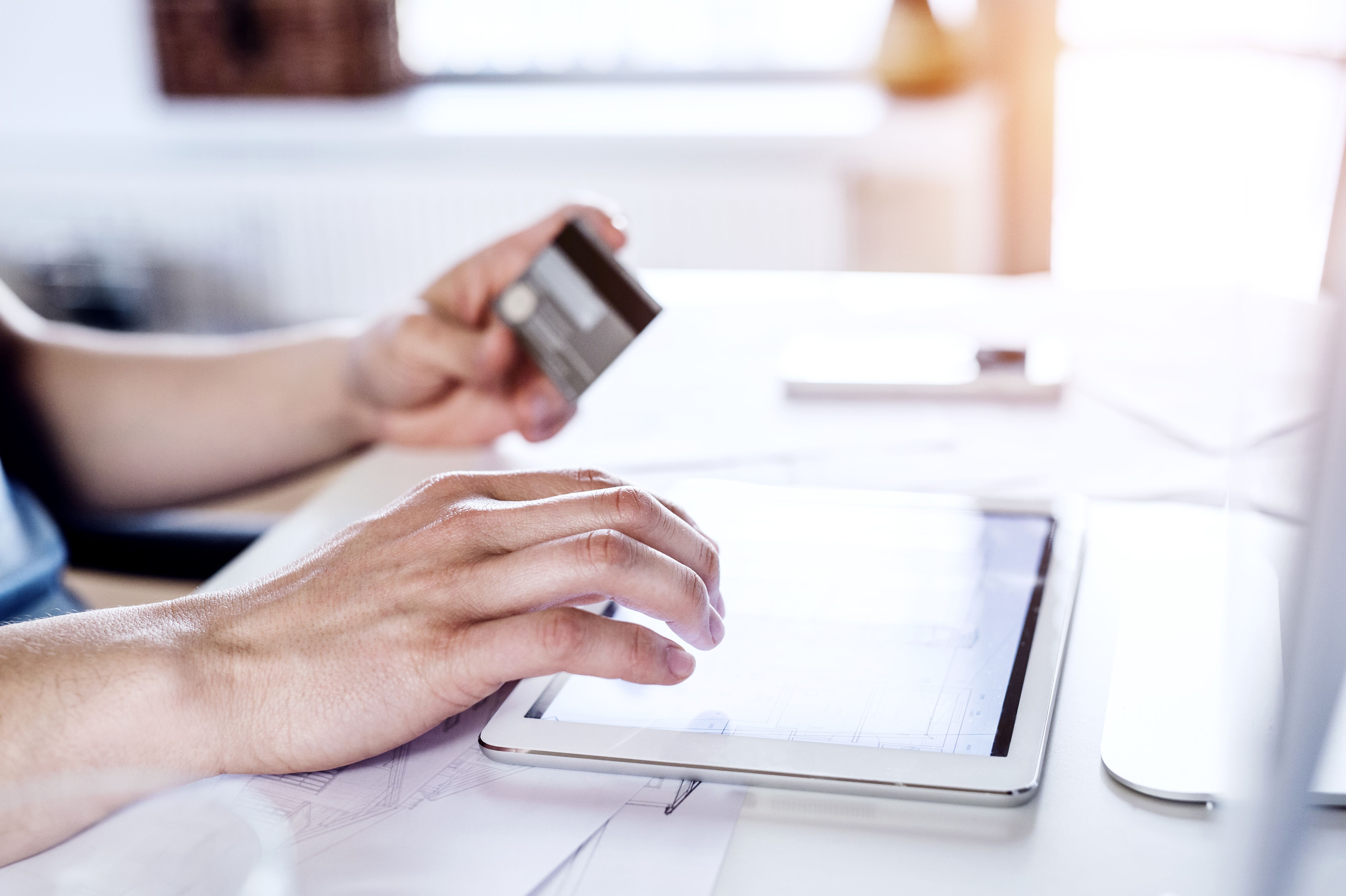 Man making online payment with credit card