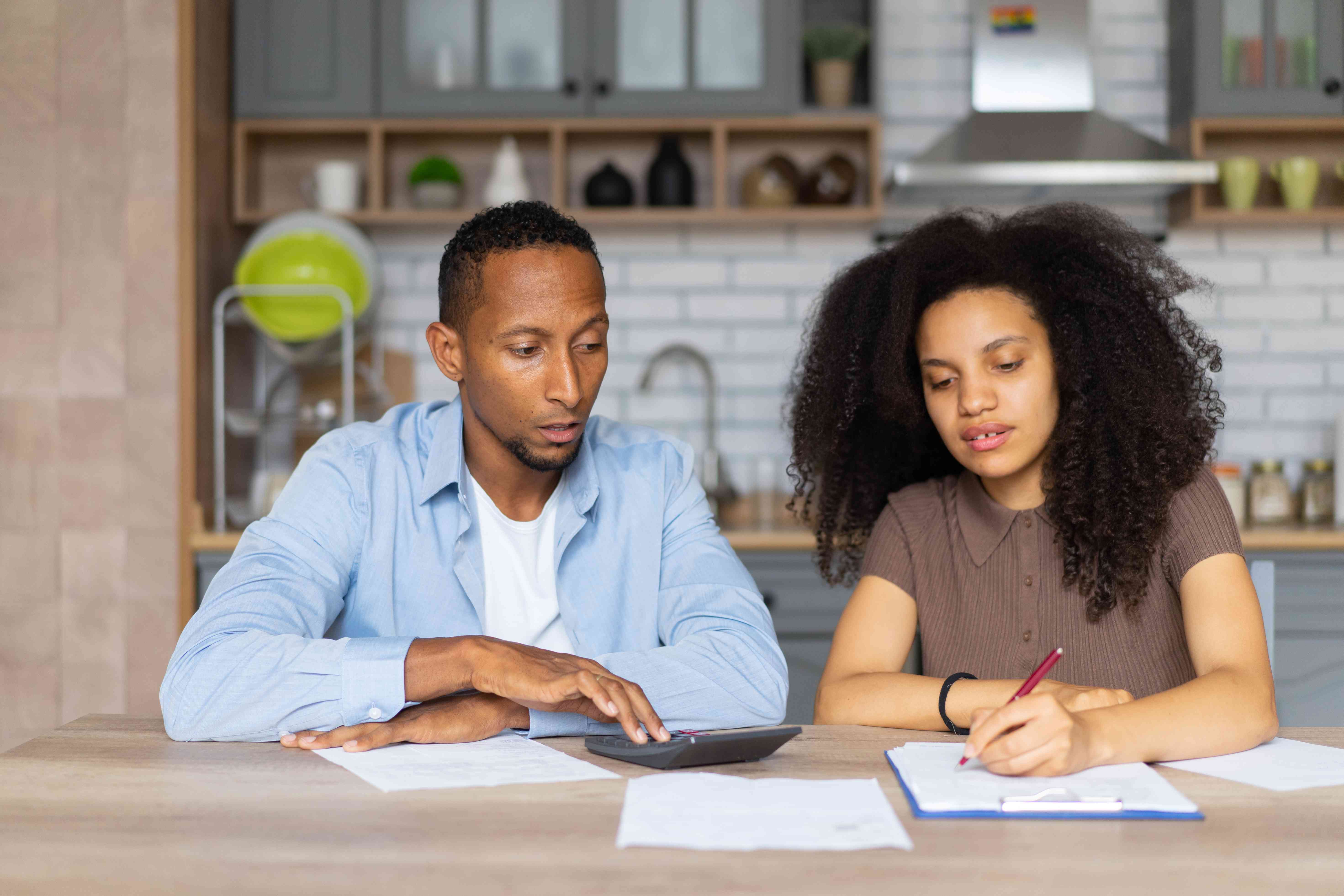 Student couple looking over loan repayment options