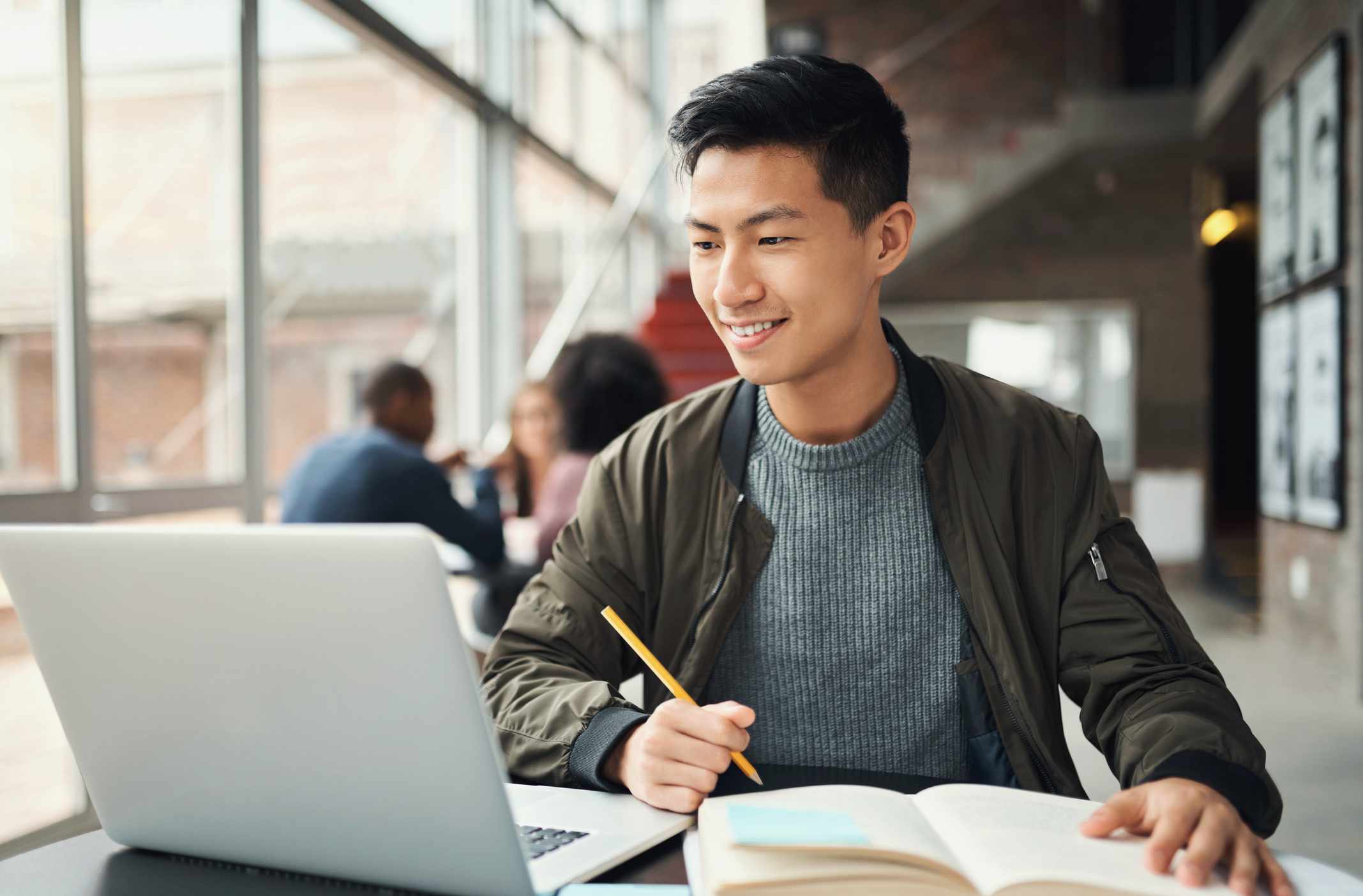 A man studies in a library.