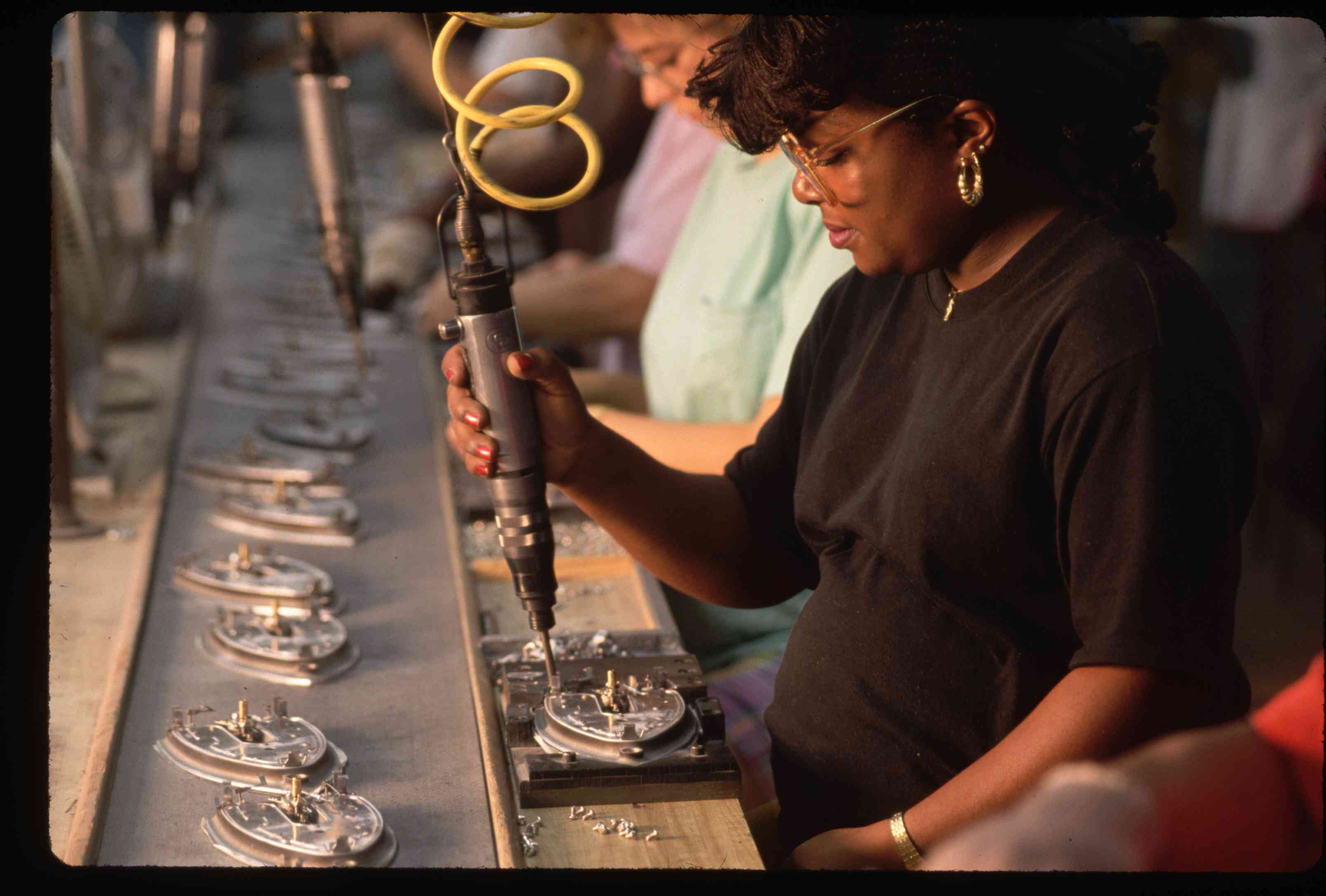 Pregnant Worker on Assembly Line